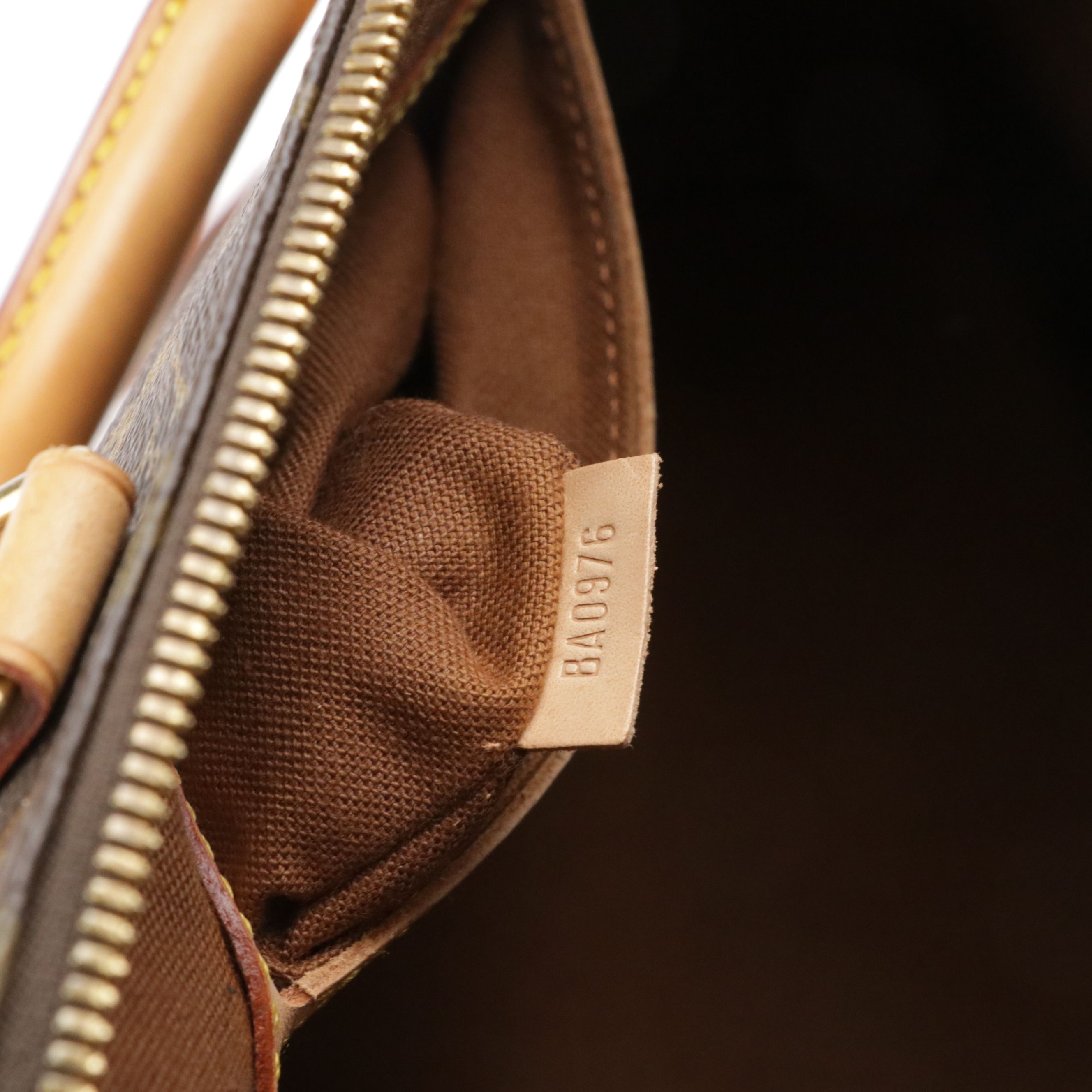 Louis Vuitton Alma PM Handbag in Monogram Canvas and Vachetta Leather