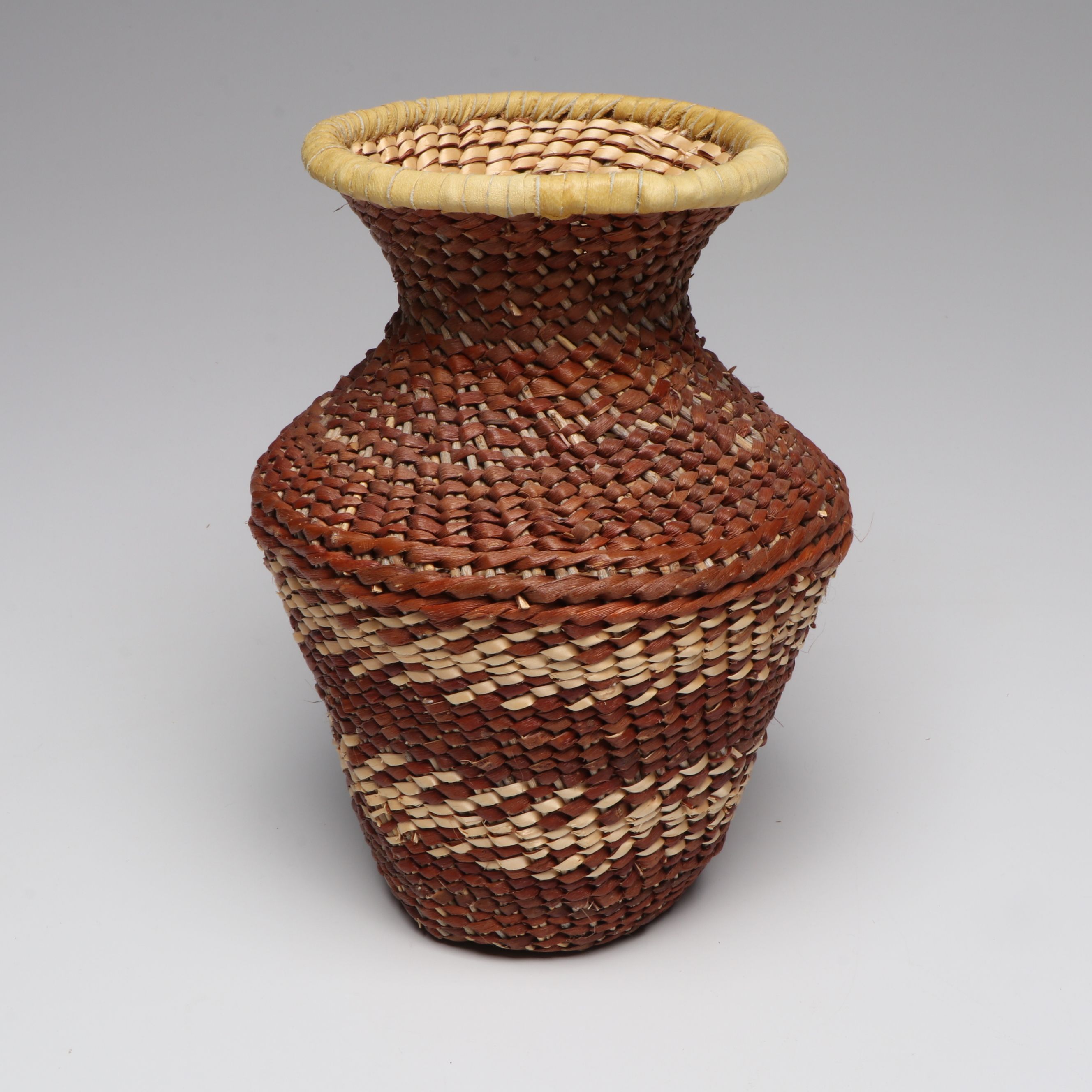 Lolita Manuel with Other Indé (Apache) Willow Fiber Basketry Vessels