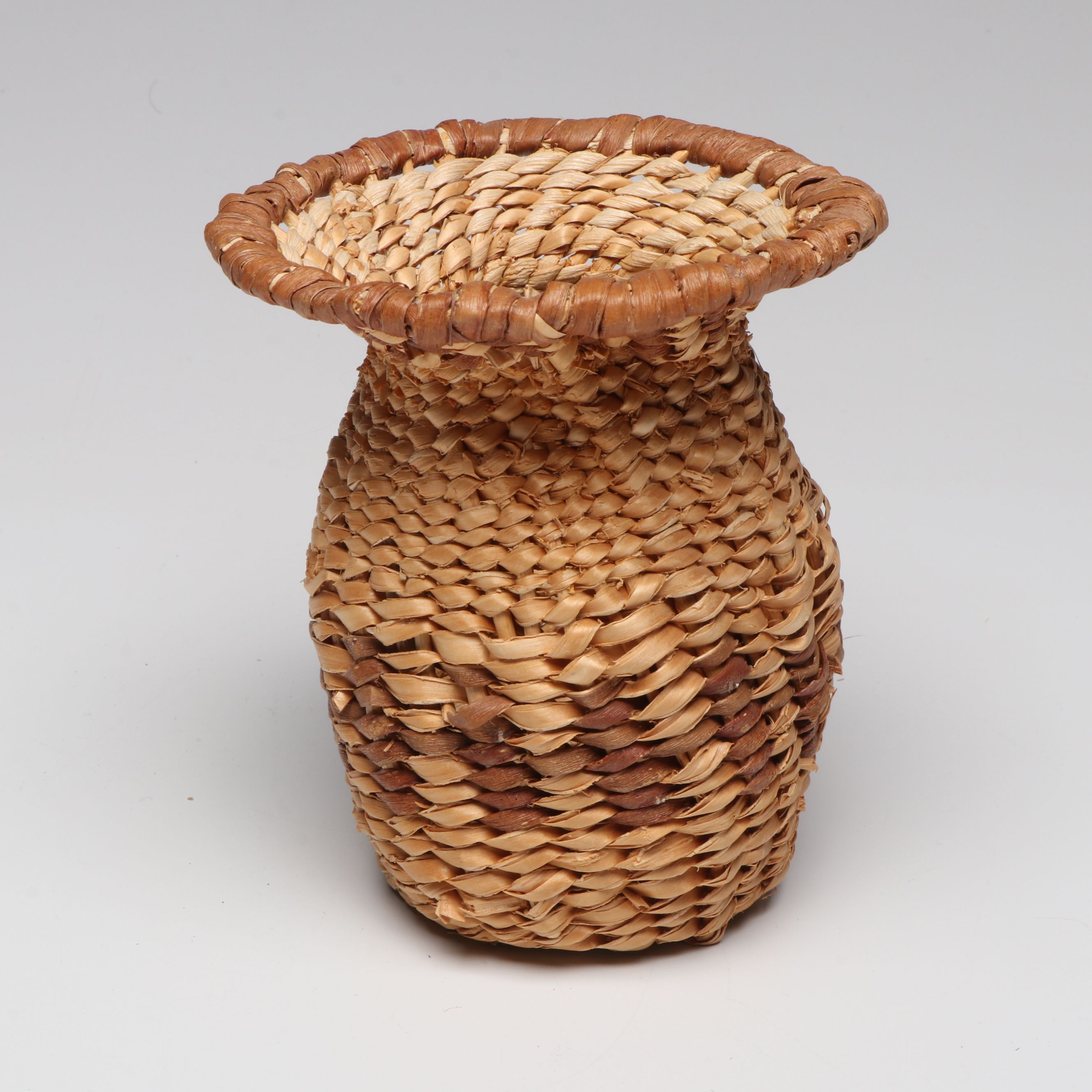 Lolita Manuel with Other Indé (Apache) Willow Fiber Basketry Vessels