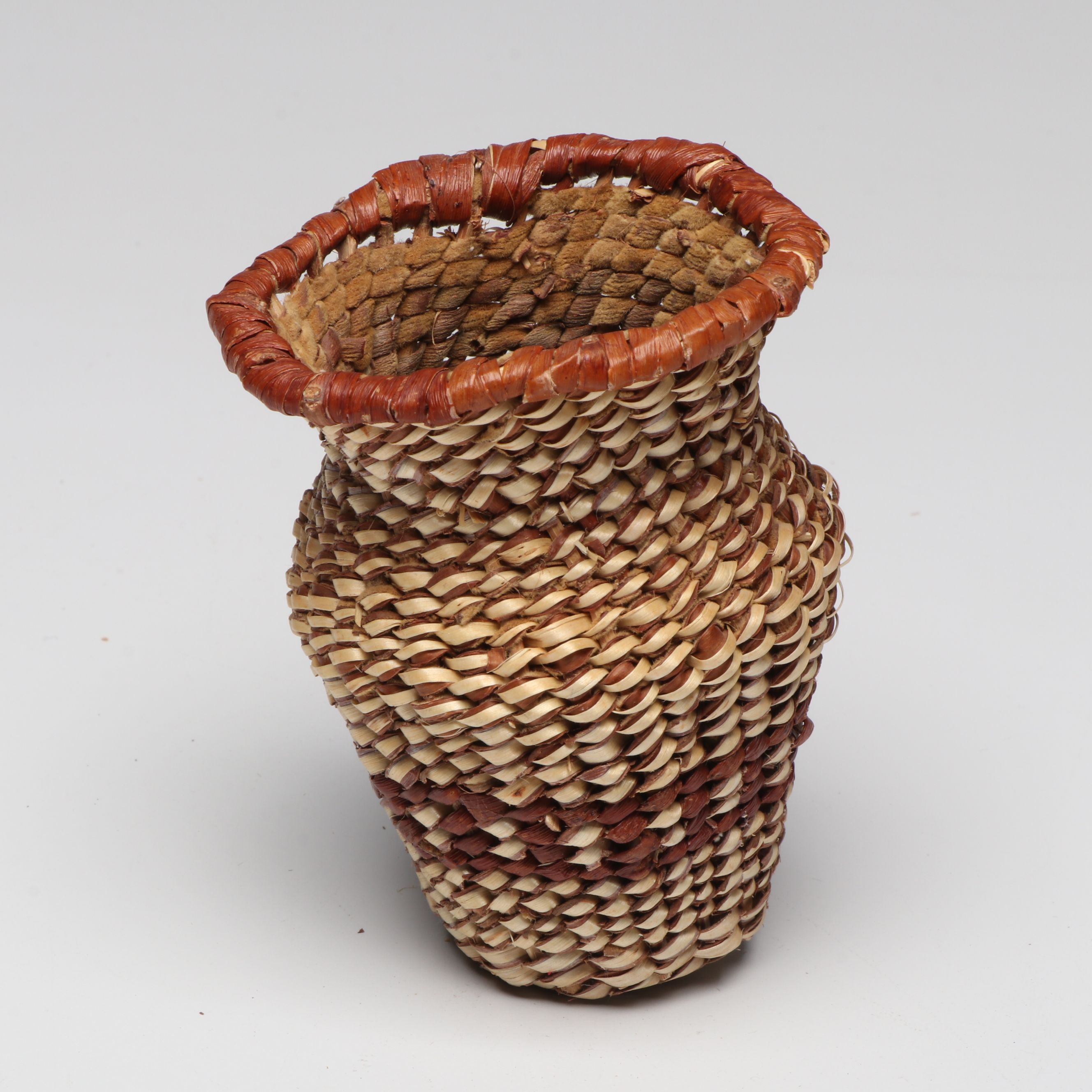 Lolita Manuel with Other Indé (Apache) Willow Fiber Basketry Vessels