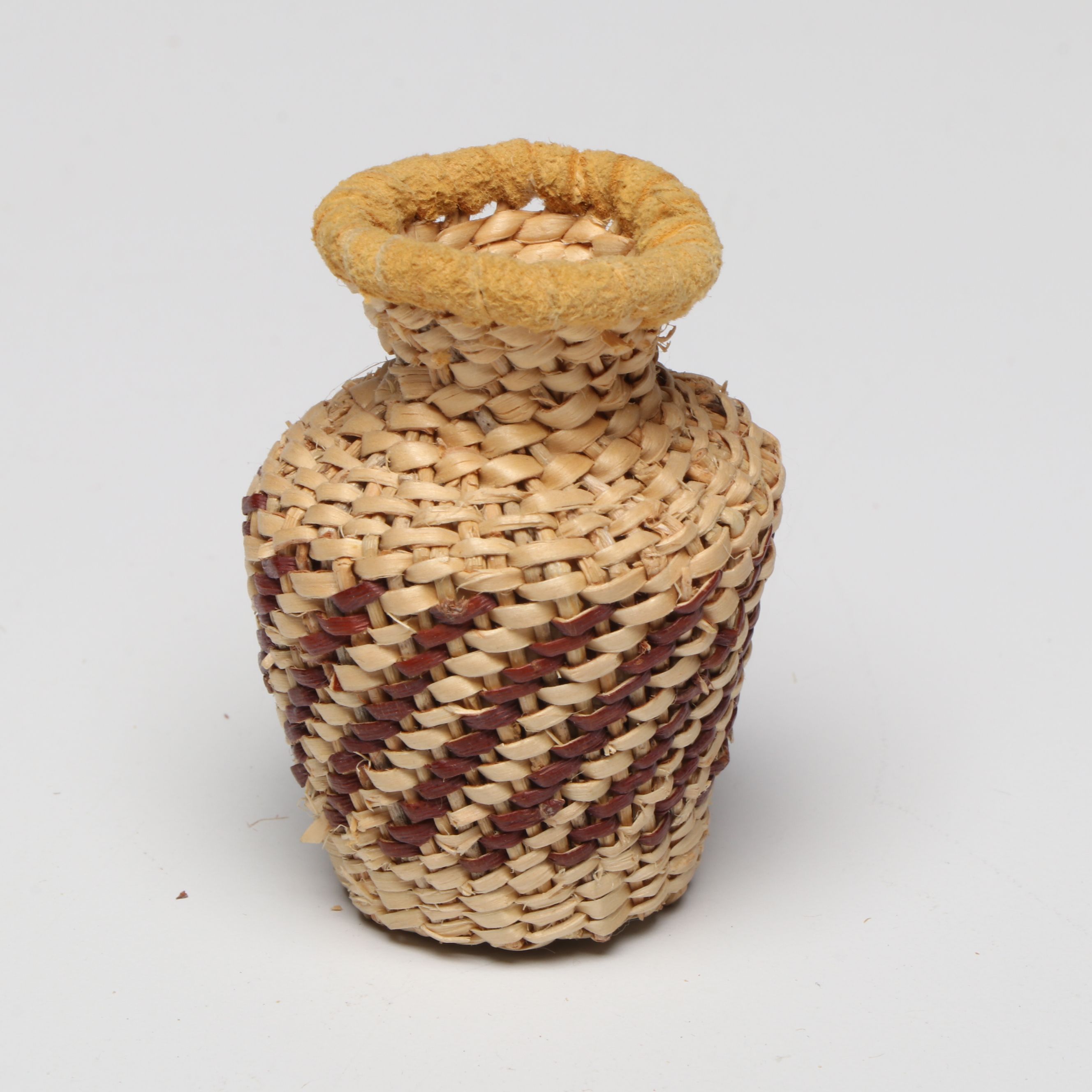 Lolita Manuel with Other Indé (Apache) Willow Fiber Basketry Vessels