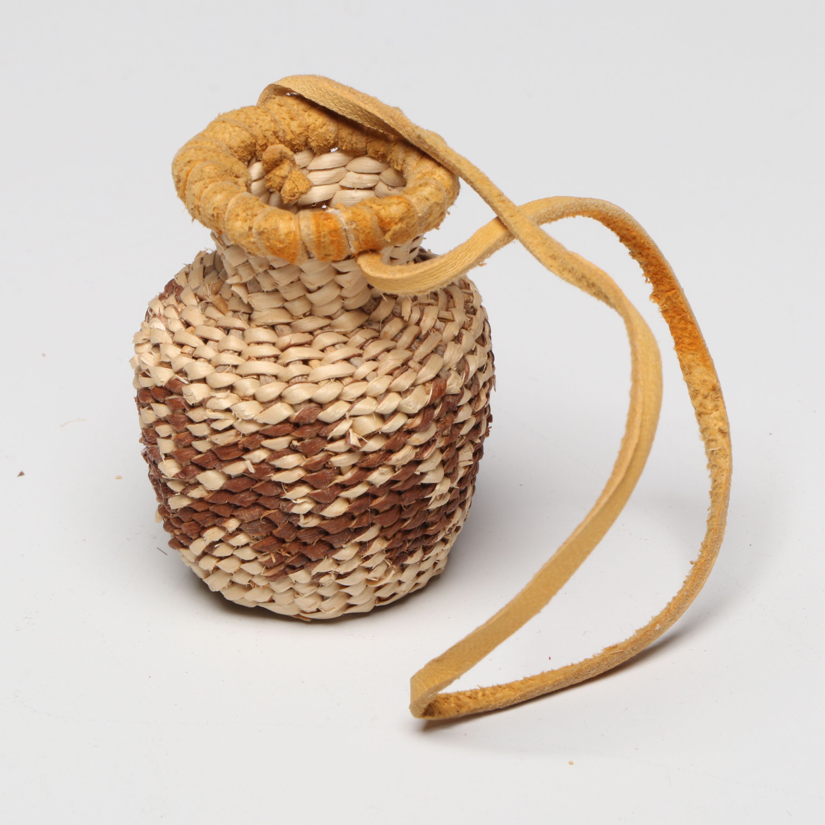 Lolita Manuel with Other Indé (Apache) Willow Fiber Basketry Vessels