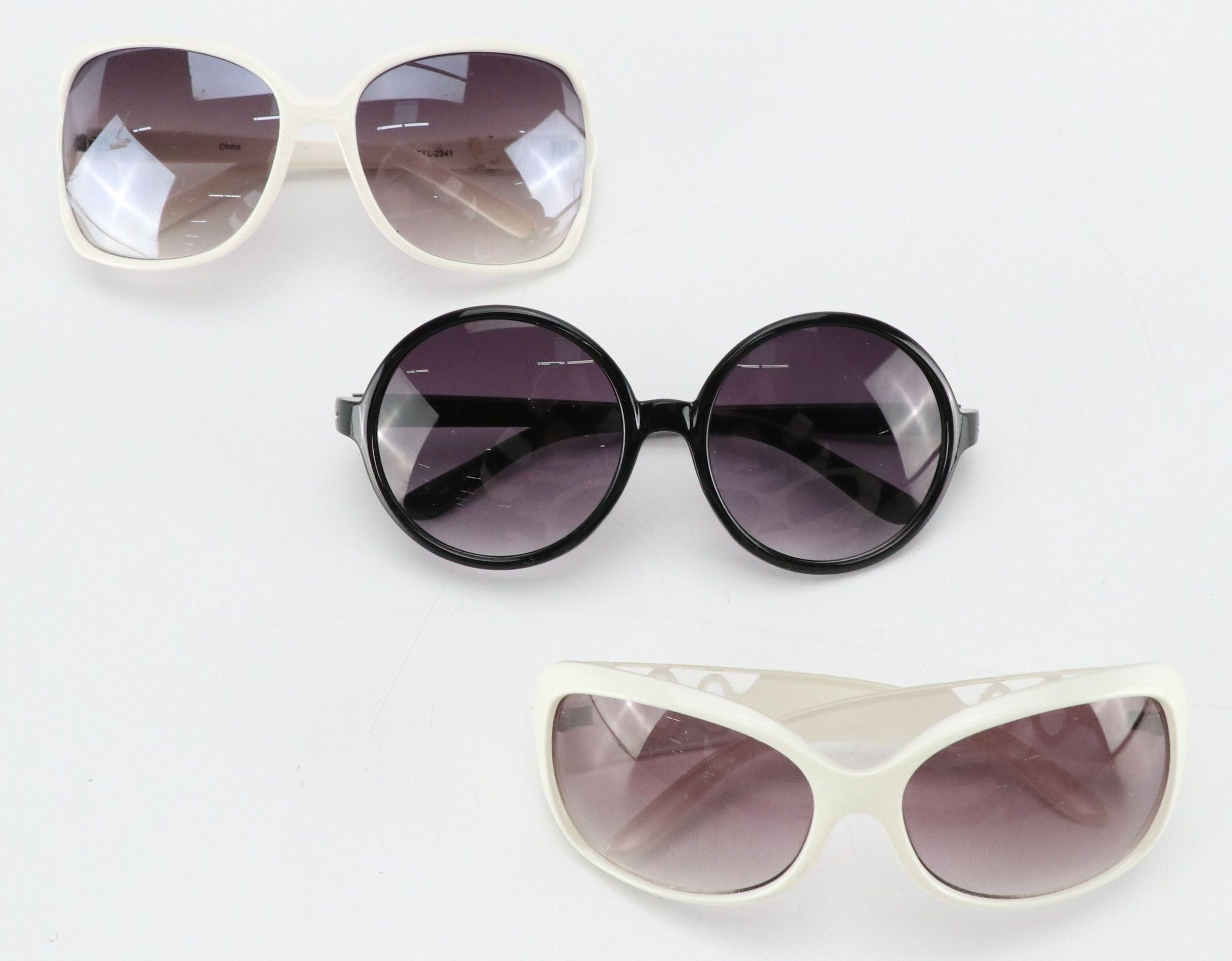 Hawaiian Tropic and Other Round/Square Sunglasses with Violet Lenses