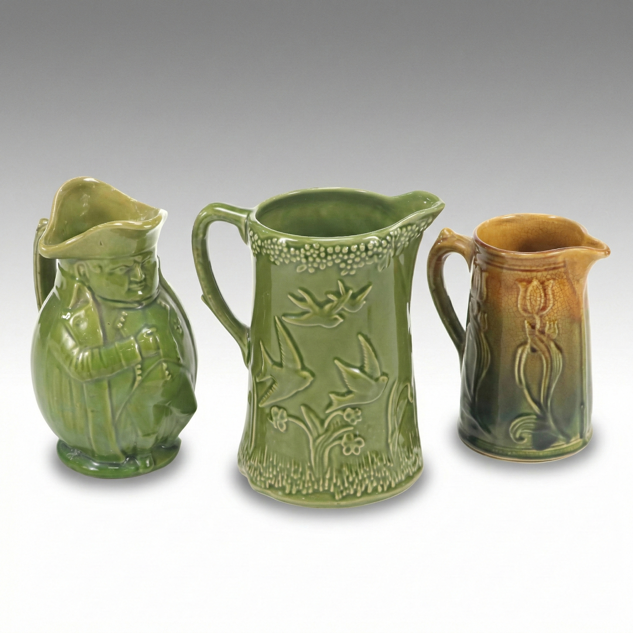 Harvest Goods Embossed Bird Stoneware Pitcher with Other Majolica Style Pitchers