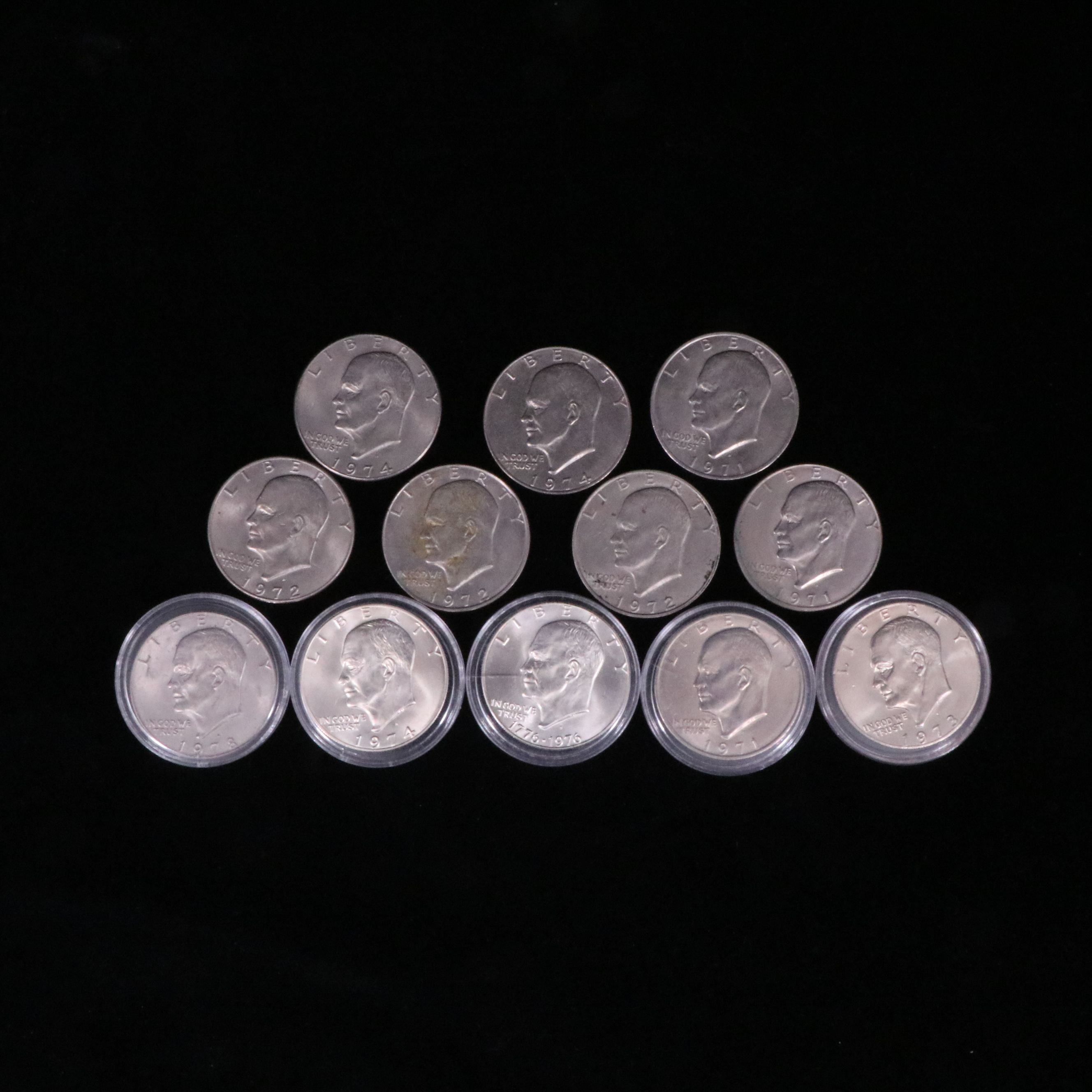 Twelve Mixed Date Eisenhower Dollars