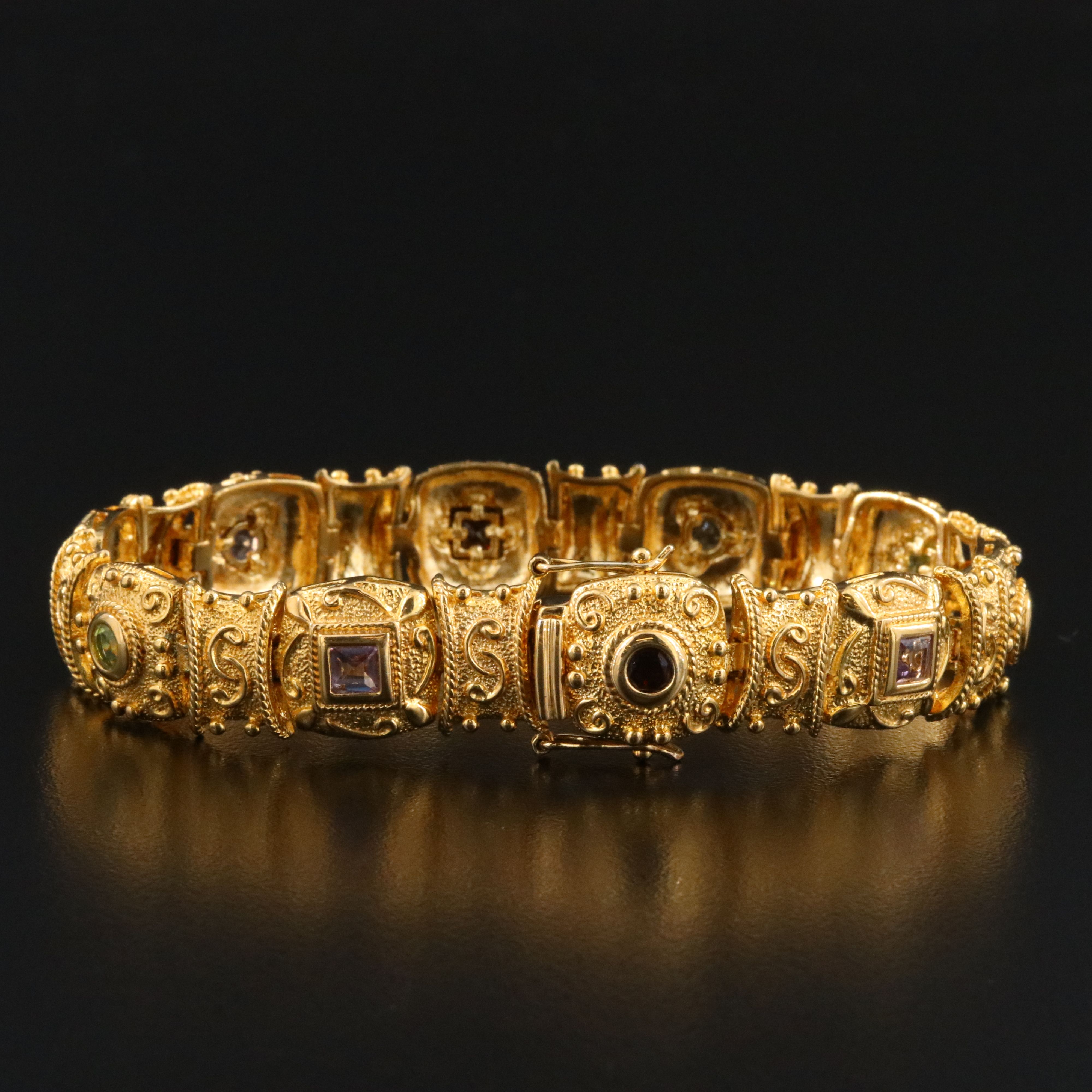 Sterling Panel Bracelet Featuring Garnet, Amethyst, and Blue Topaz