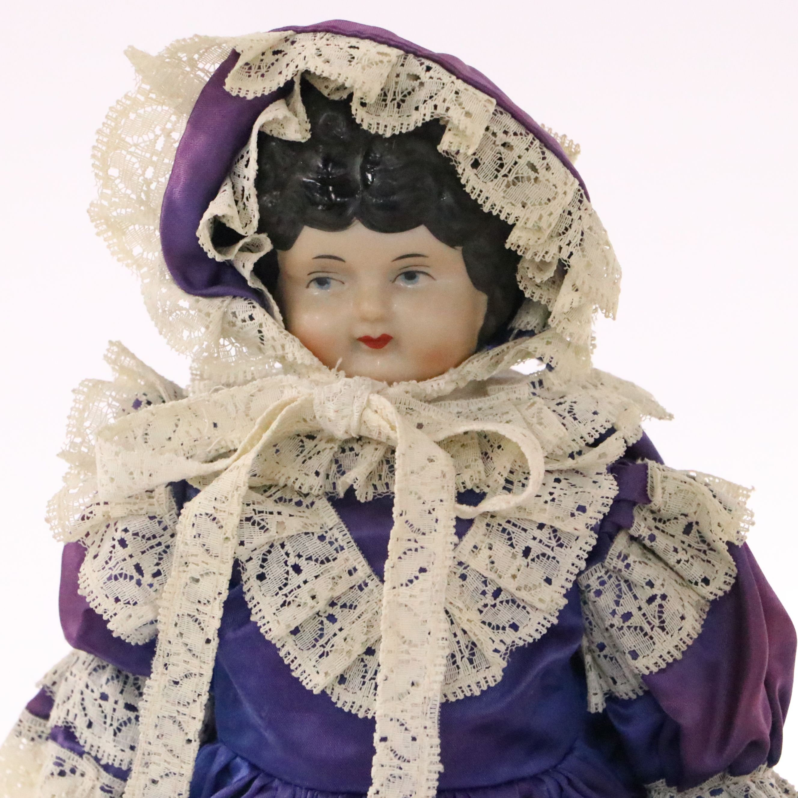 German Bisque Lady Doll with Molded Blonde Hair and Collar with Other Dolls
