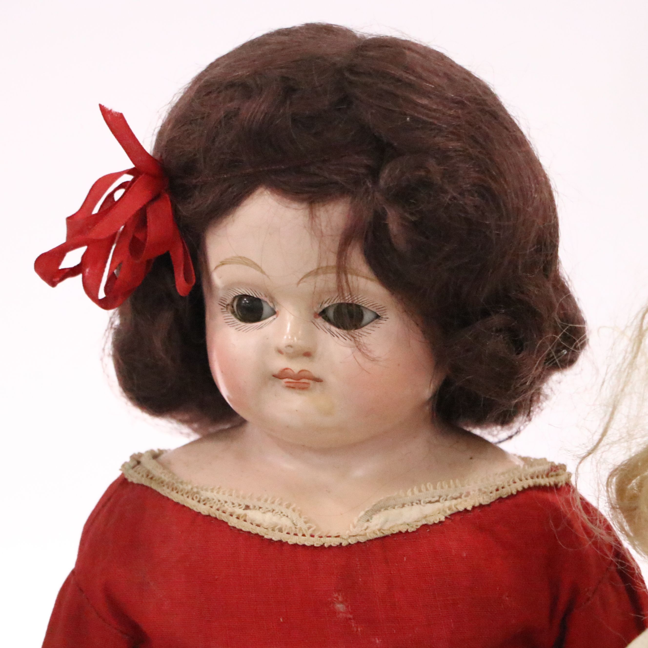 German Bisque Lady Doll with Molded Blonde Hair and Collar with Other Dolls