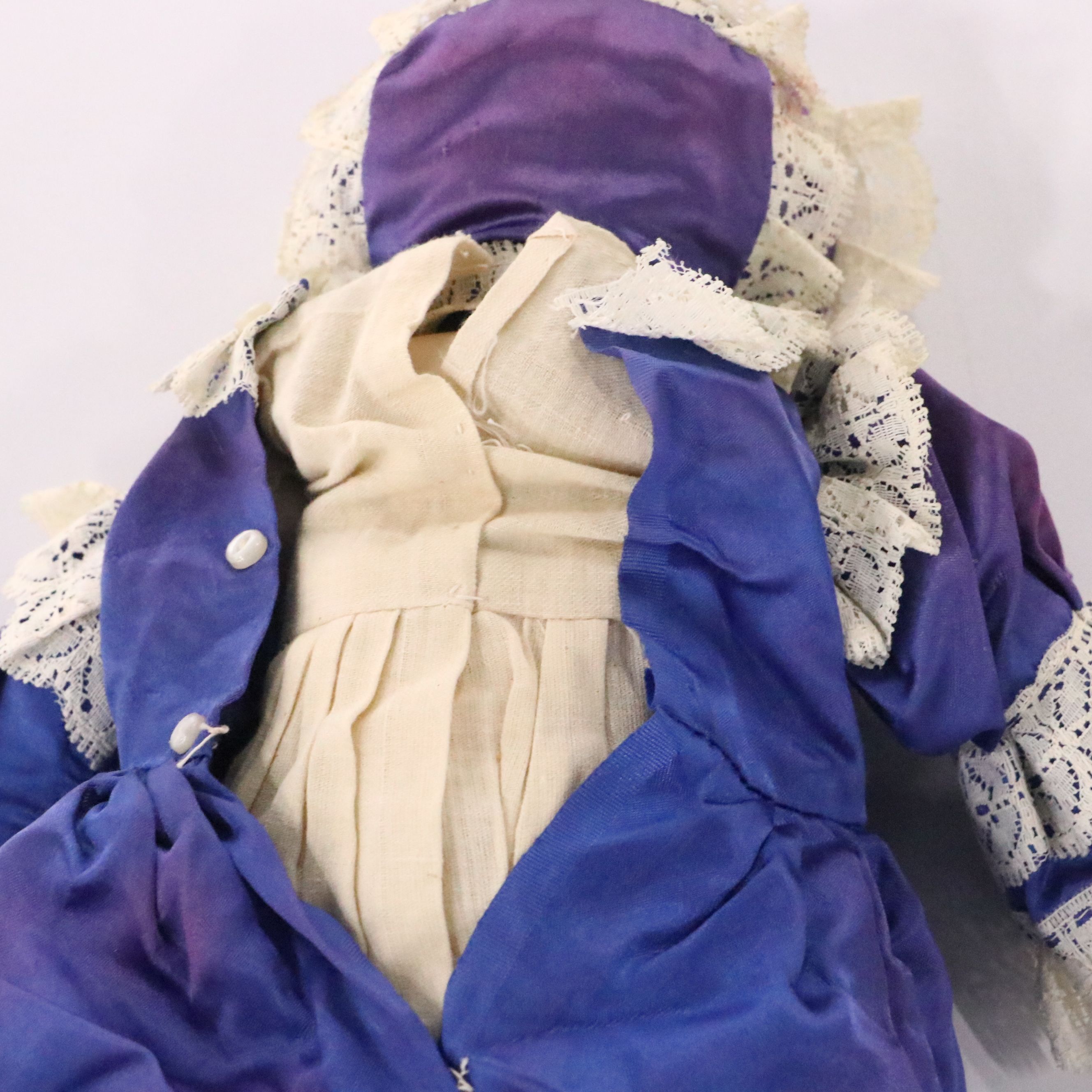 German Bisque Lady Doll with Molded Blonde Hair and Collar with Other Dolls