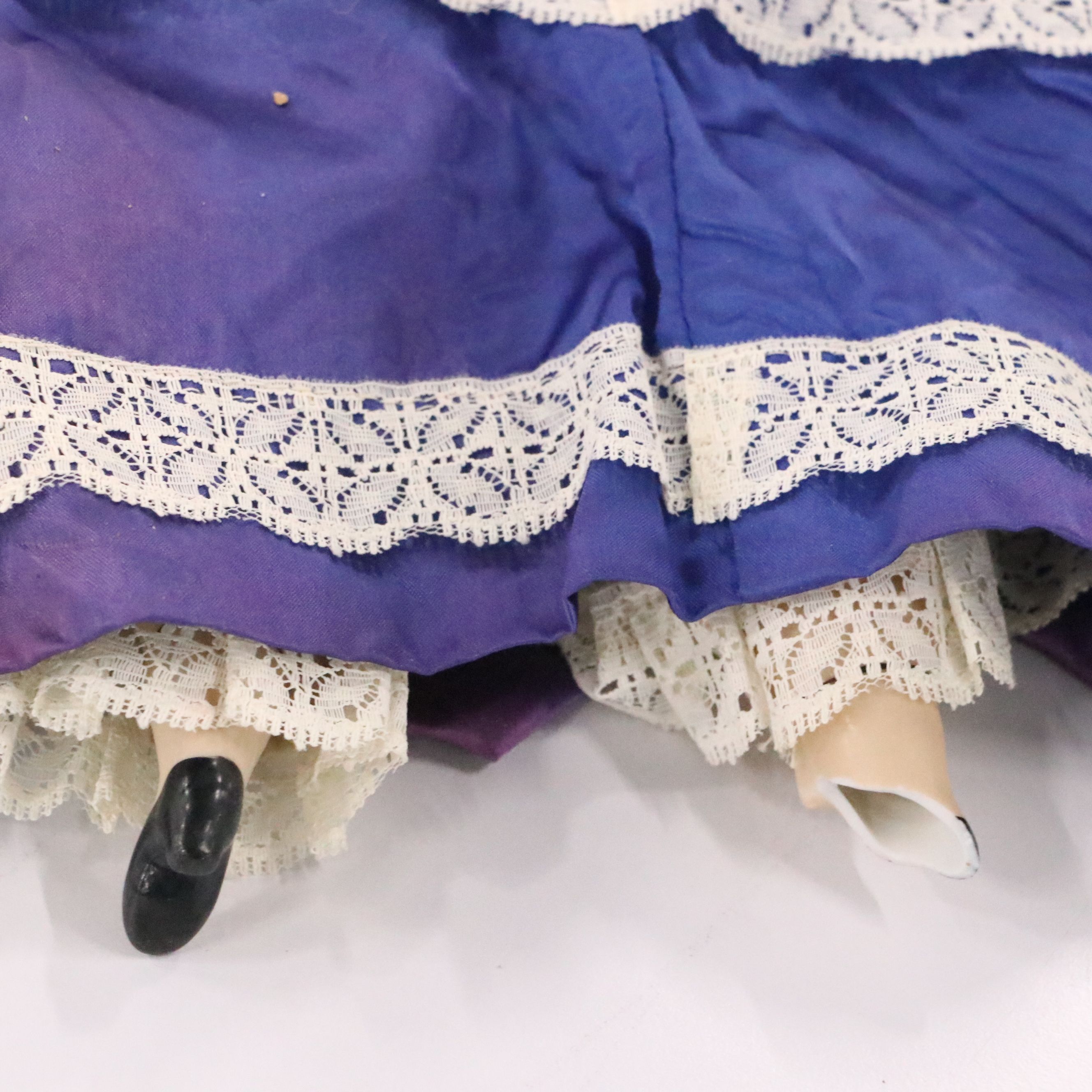 German Bisque Lady Doll with Molded Blonde Hair and Collar with Other Dolls