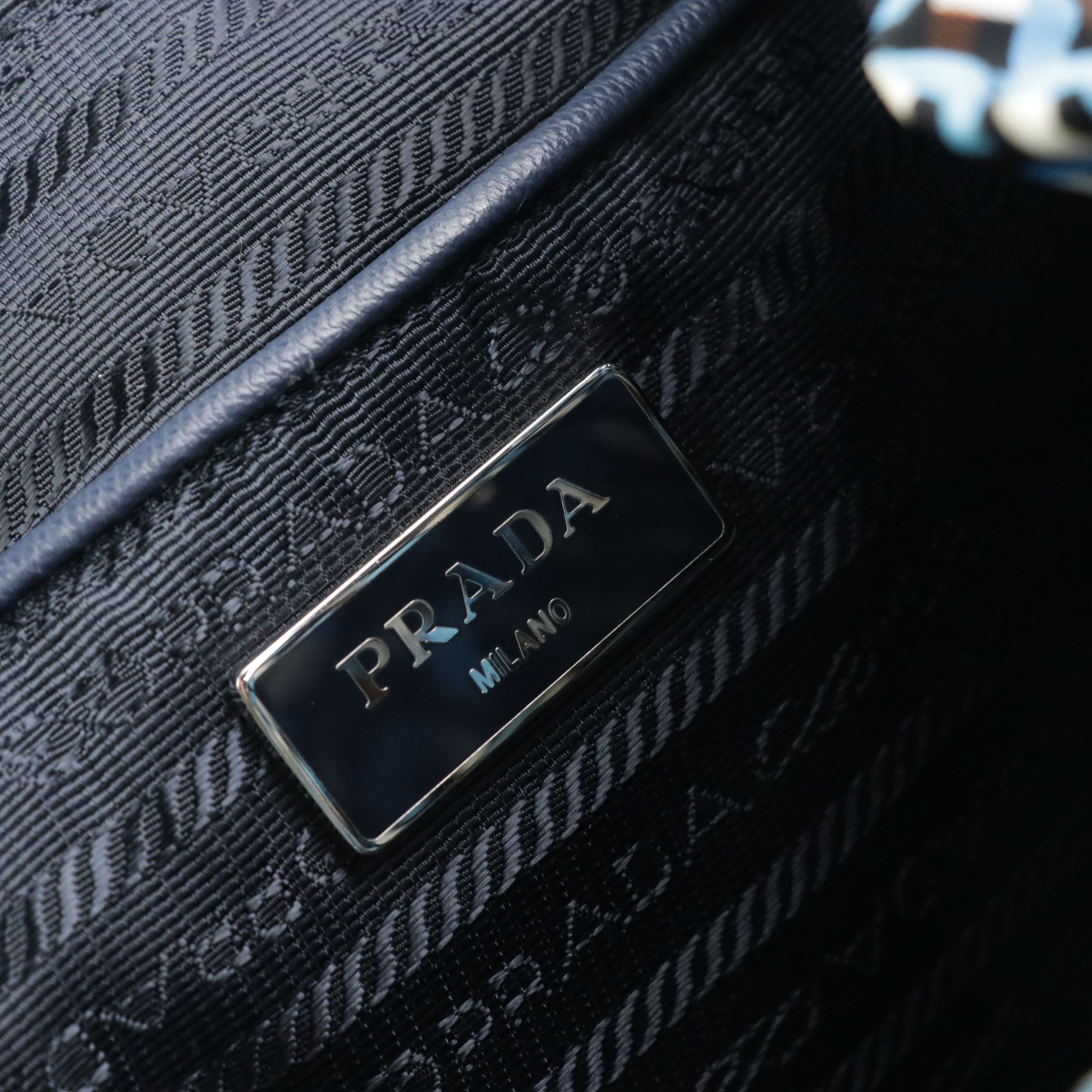 Prada Drawstring Backpack in Stampato Tessuto Nylon and Navy Saffiano Leather