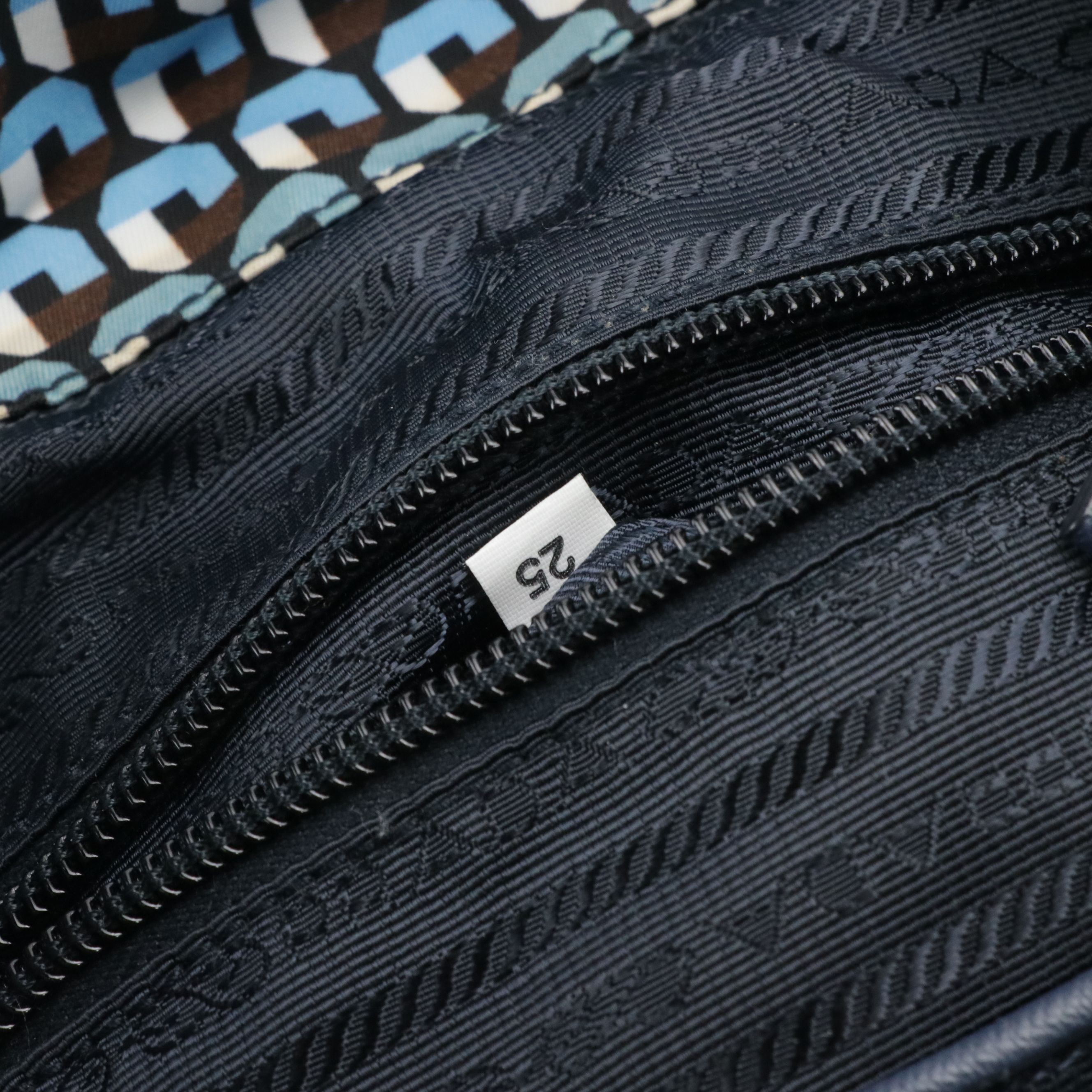 Prada Drawstring Backpack in Stampato Tessuto Nylon and Navy Saffiano Leather