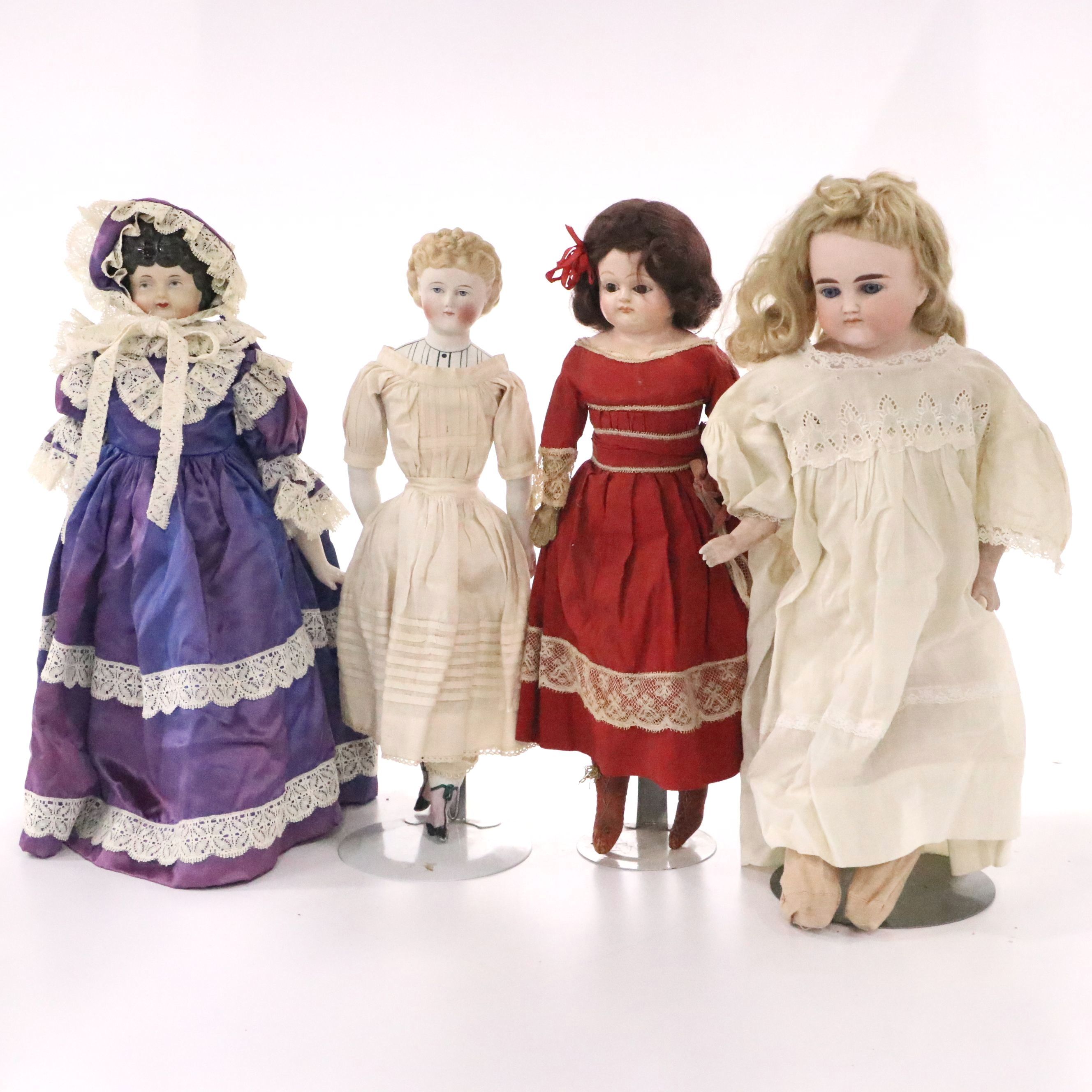 German Bisque Lady Doll with Molded Blonde Hair and Collar with Other Dolls