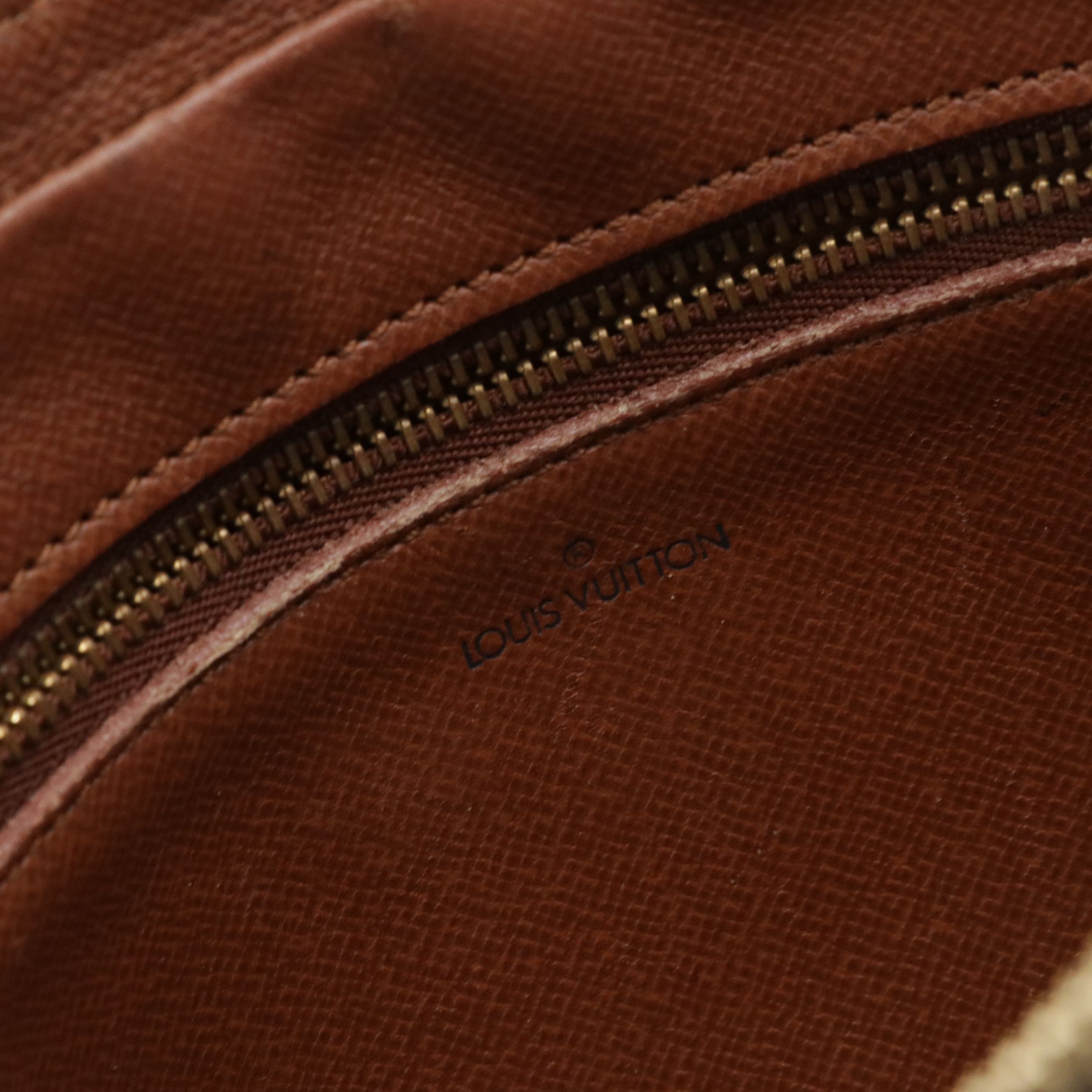 Louis Vuitton Marly Dragonne GM Wristlet in Monogram Canvas and Vachetta Leather