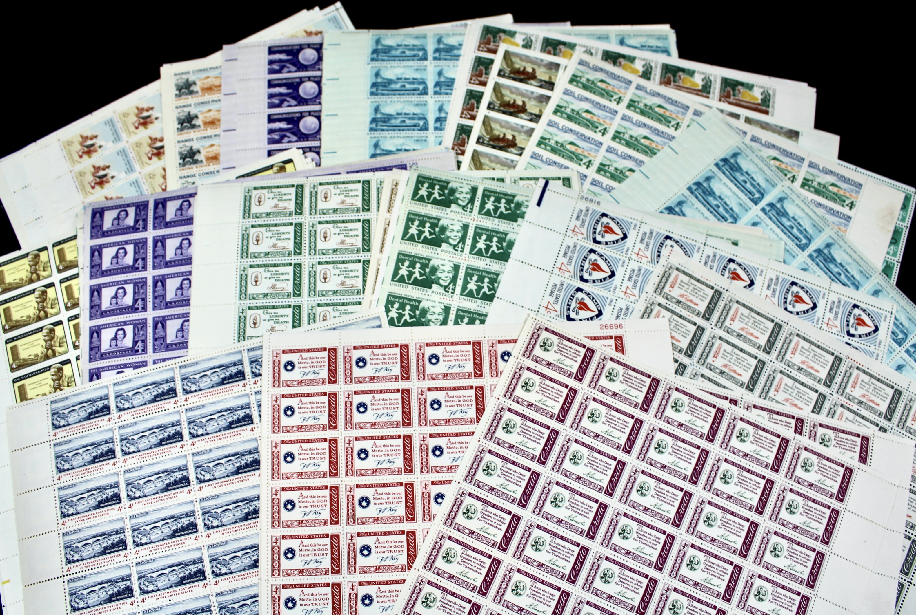 100 U.S. 4-Cent Postage Stamp Sheets, 1950s to 1960s