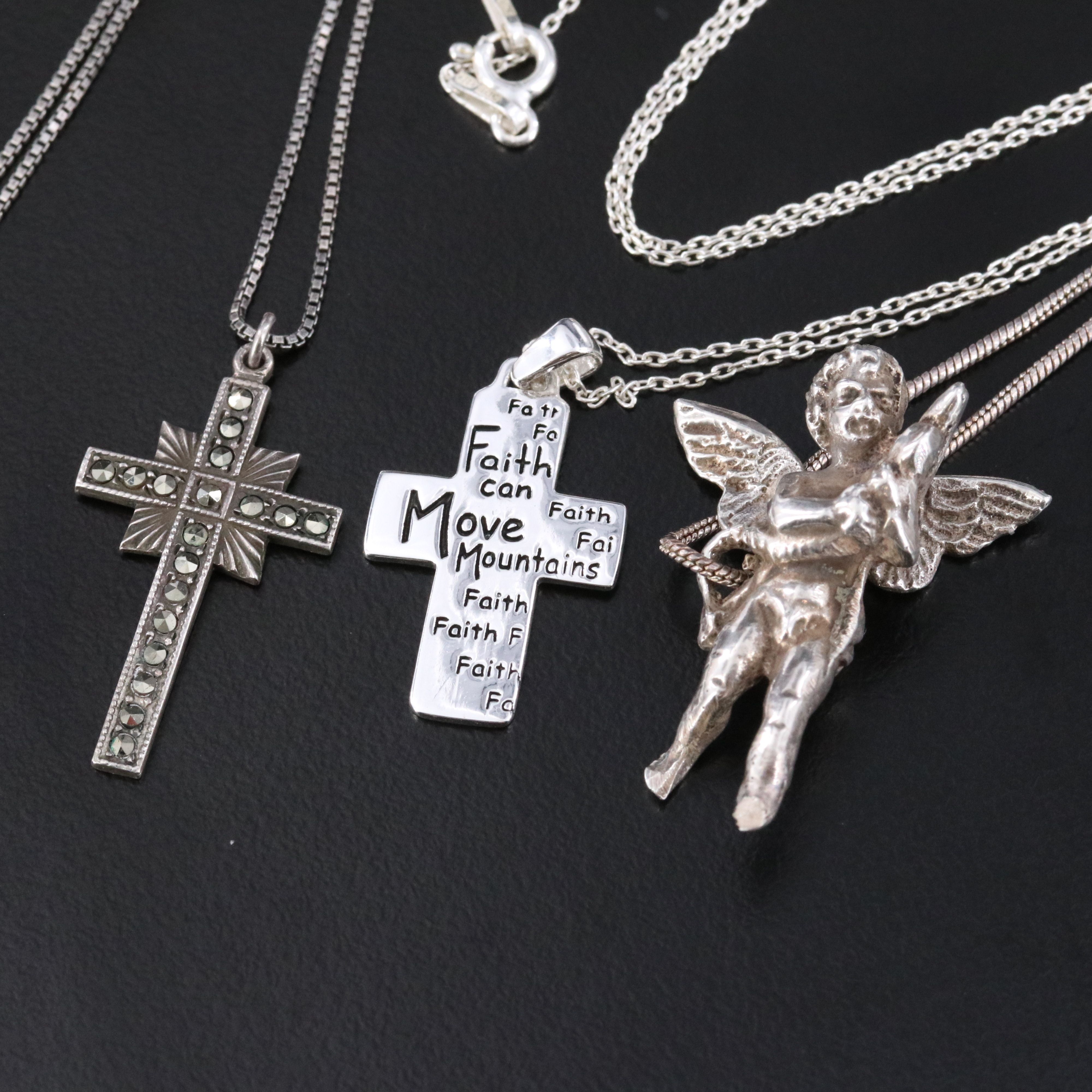 Sterling Religious Iconography Jewelry Featuring Blue Topaz and Marcasite