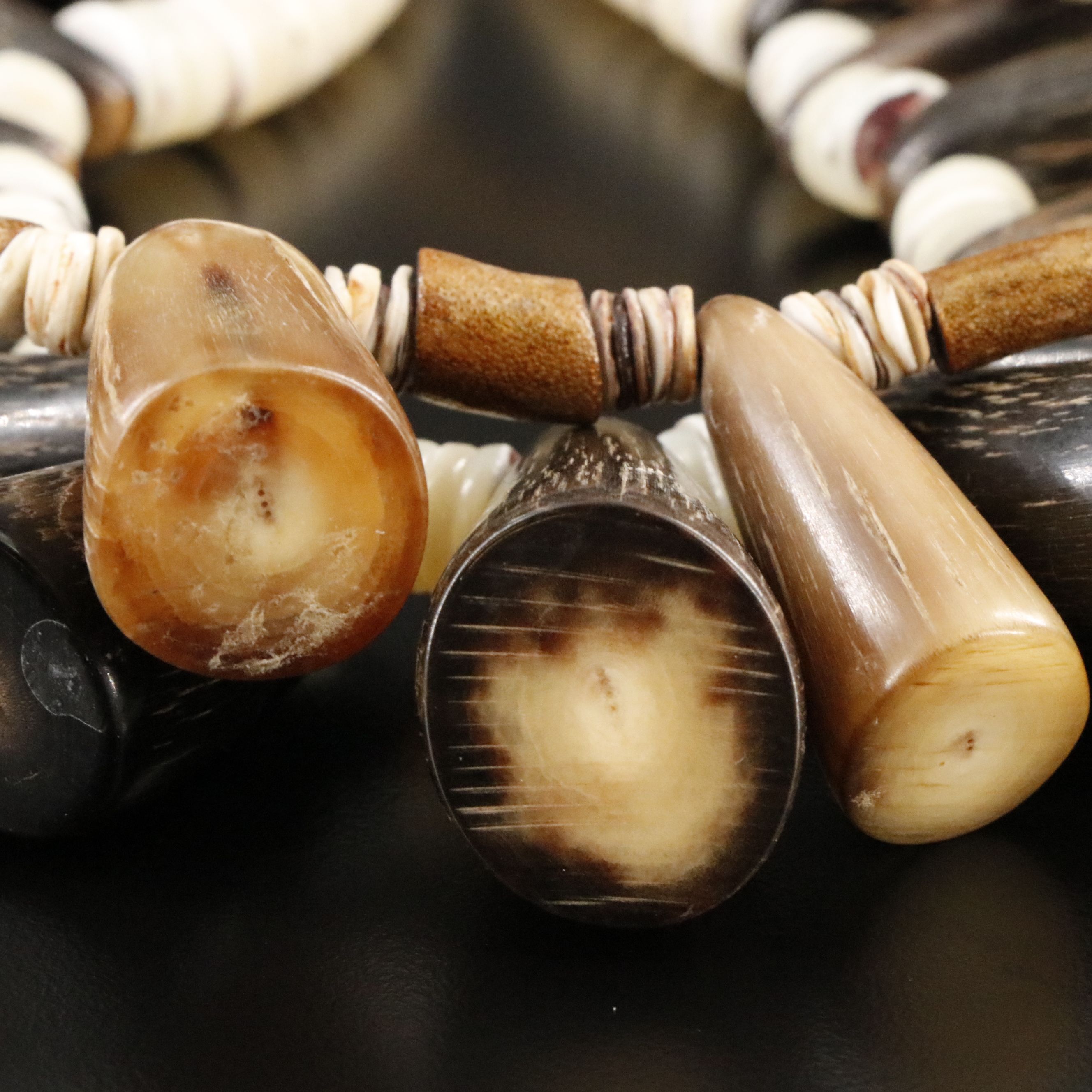 Horn, Coral and Turquoise Featured in Necklaces