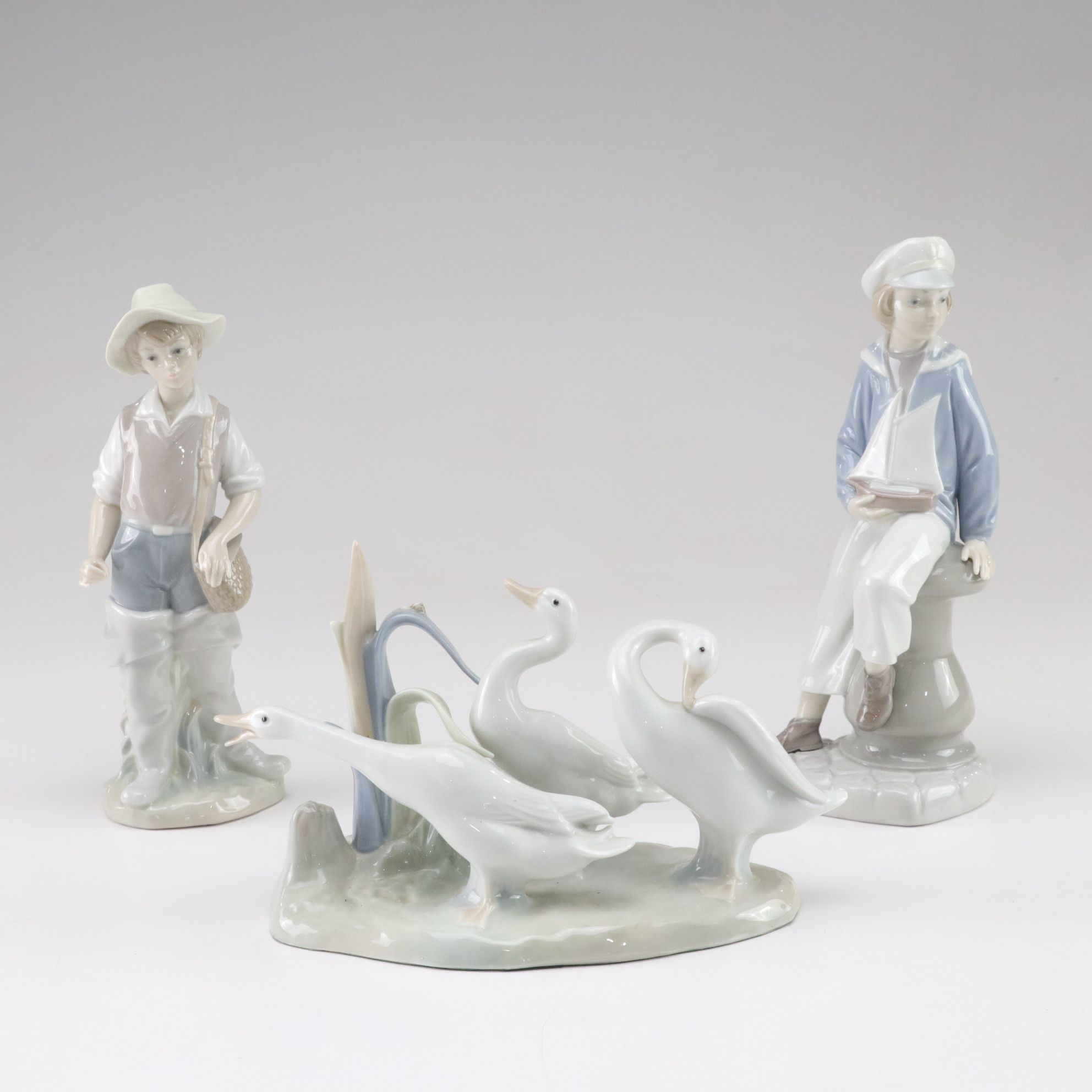 Lladró "Going Fishing," "Boy with Yacht," and "Geese" Porcelain Figurines, 1970s