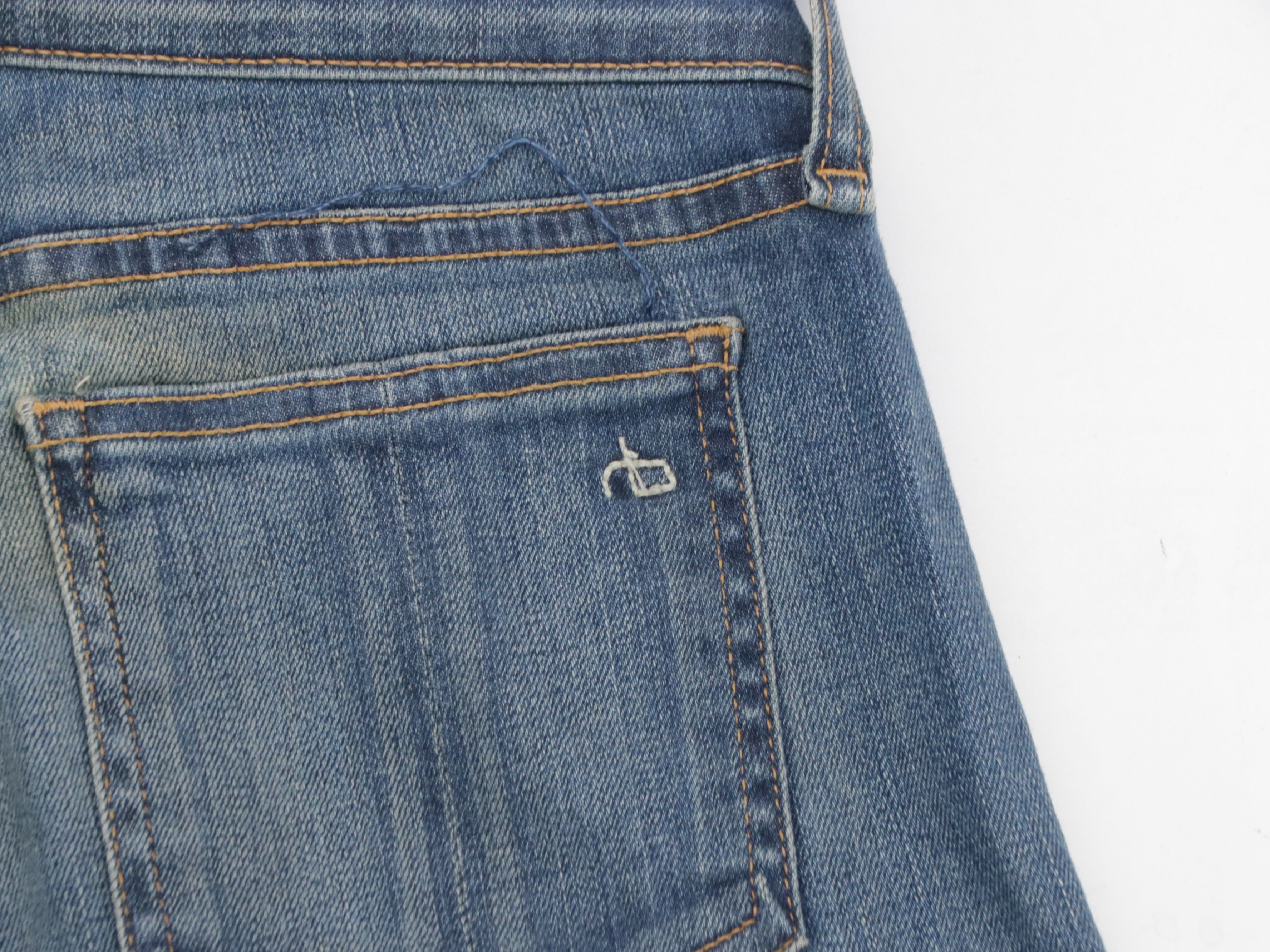 Rag & Bone Ripped Blue Wash and and Black Skinny Jeans