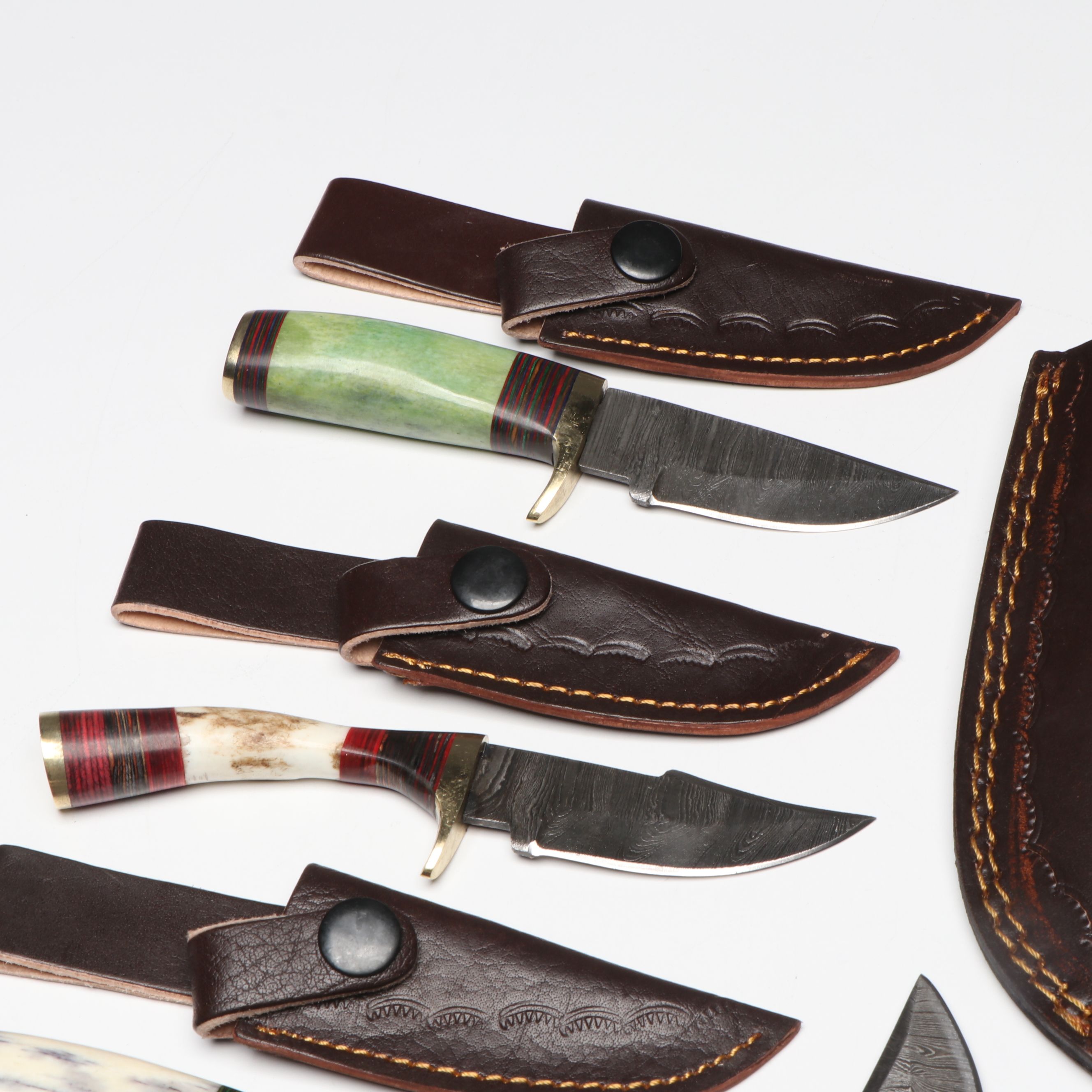 Damascus Steel Skinner and Hunting Knives in Leather Scabbards