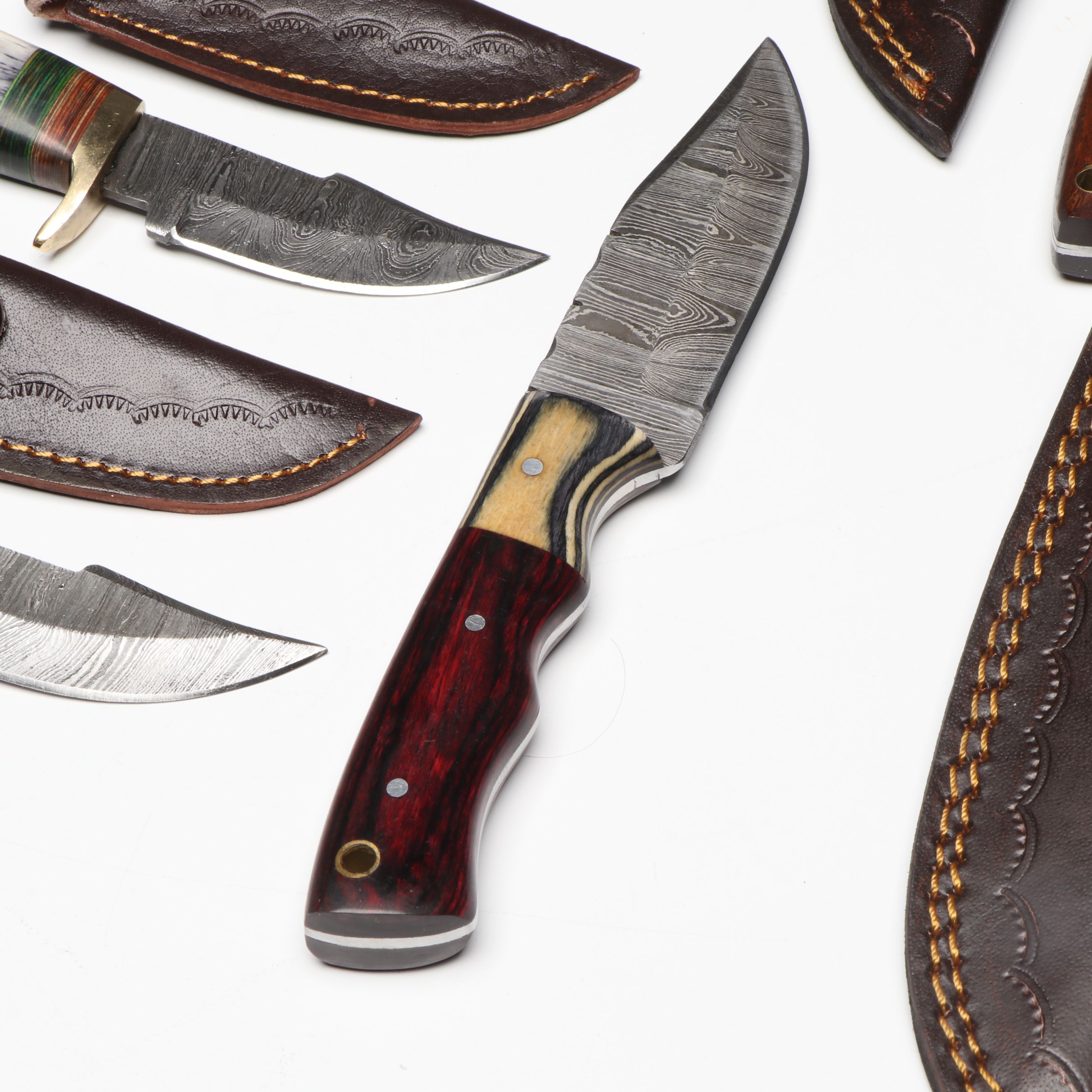Damascus Steel Skinner and Hunting Knives in Leather Scabbards