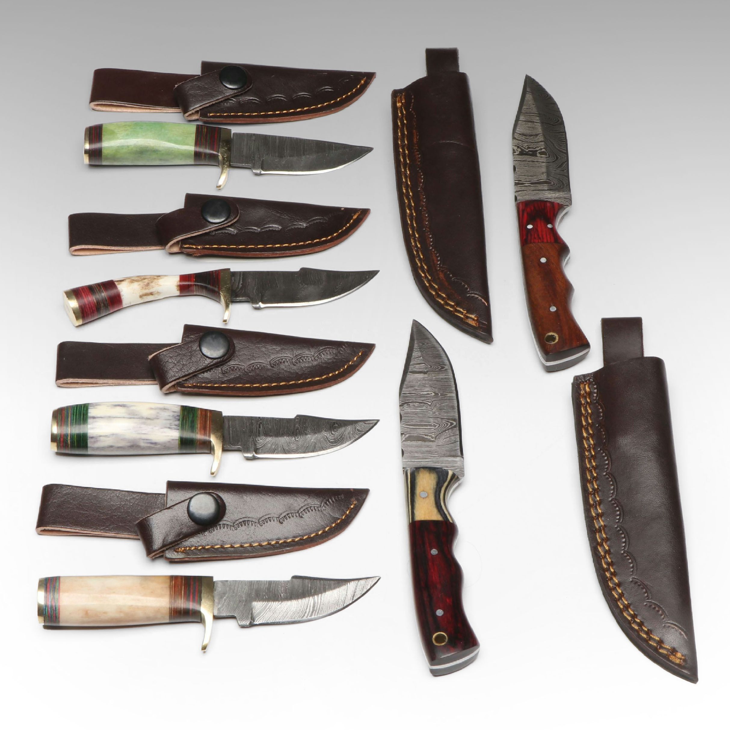 Damascus Steel Skinner and Hunting Knives in Leather Scabbards