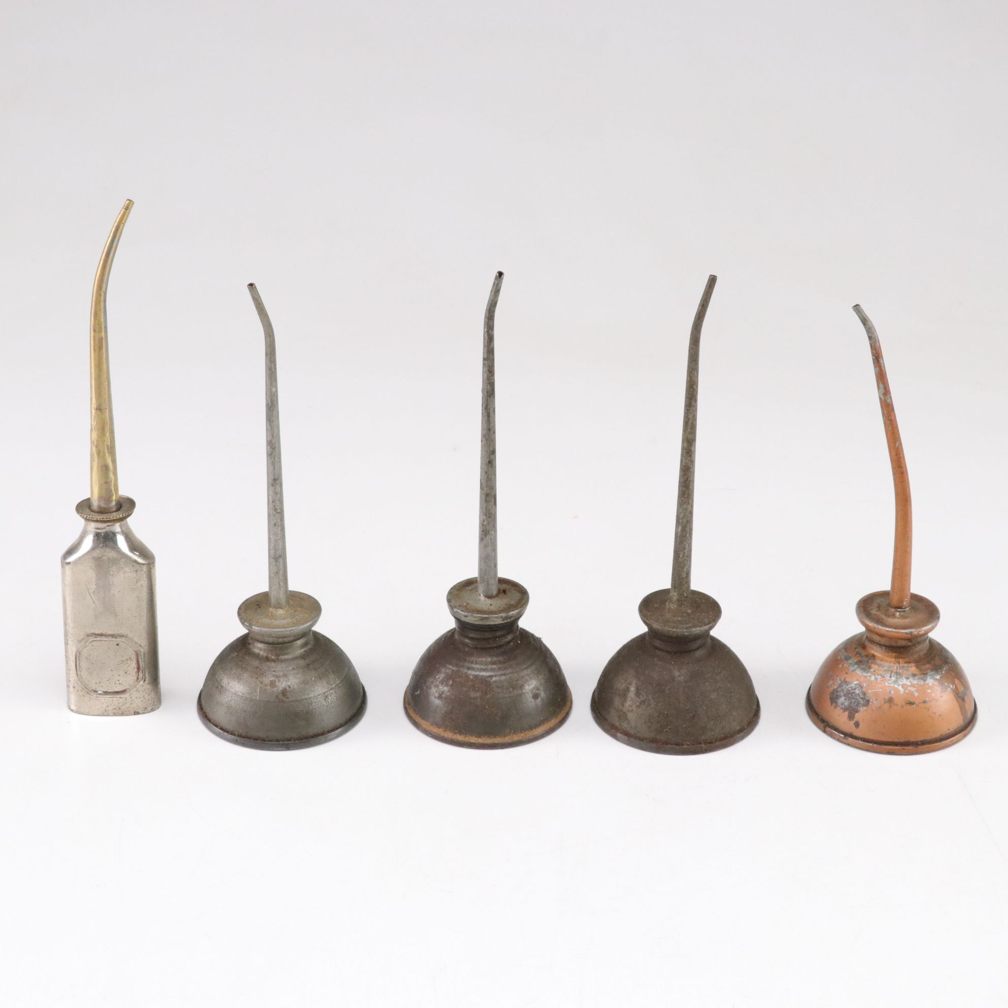 WWII Era Gun Oil Can with Other Oil Cans and Grinding Wheel, Mid-20th Century