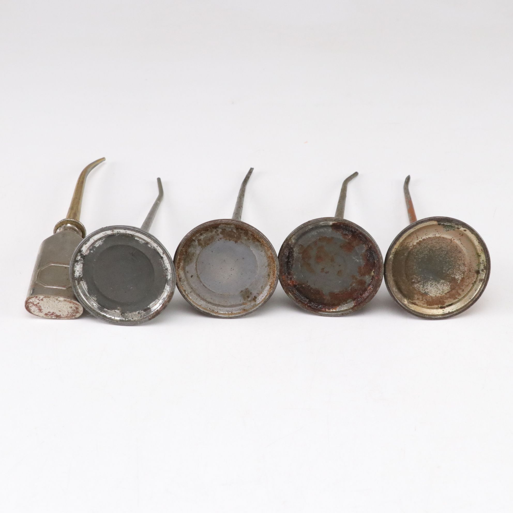 WWII Era Gun Oil Can with Other Oil Cans and Grinding Wheel, Mid-20th Century