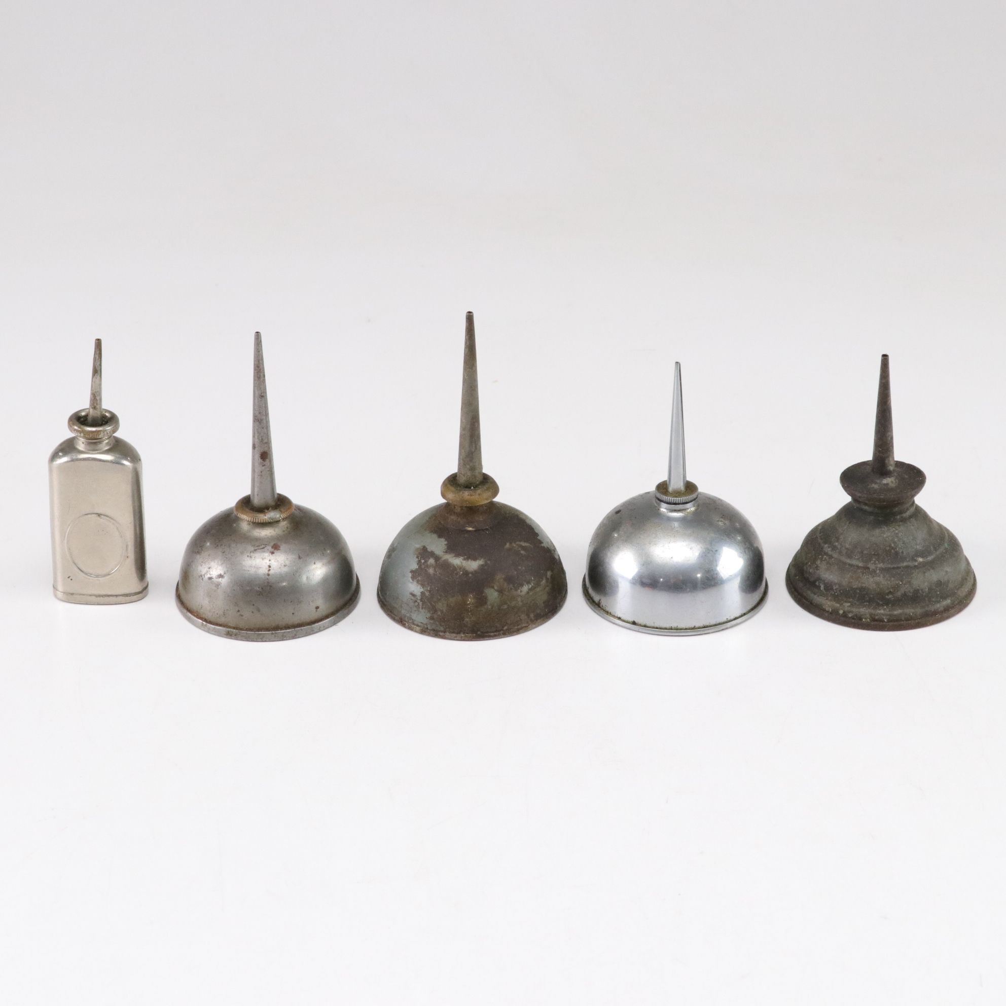 WWII Era Gun Oil Can with Other Oil Cans and Grinding Wheel, Mid-20th Century