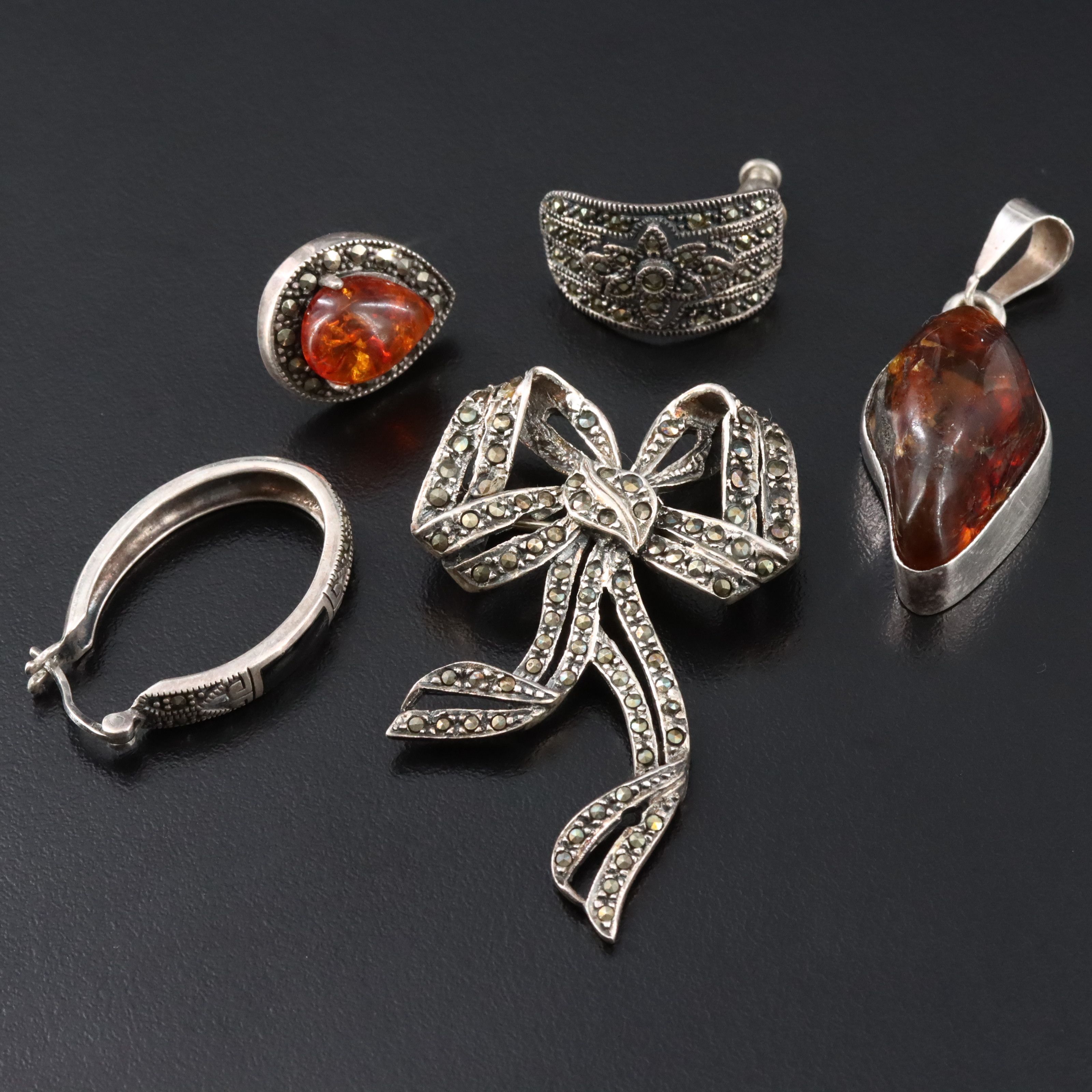 Amber, Black Onyx and Marcasite Featured in Sterling Jewelry