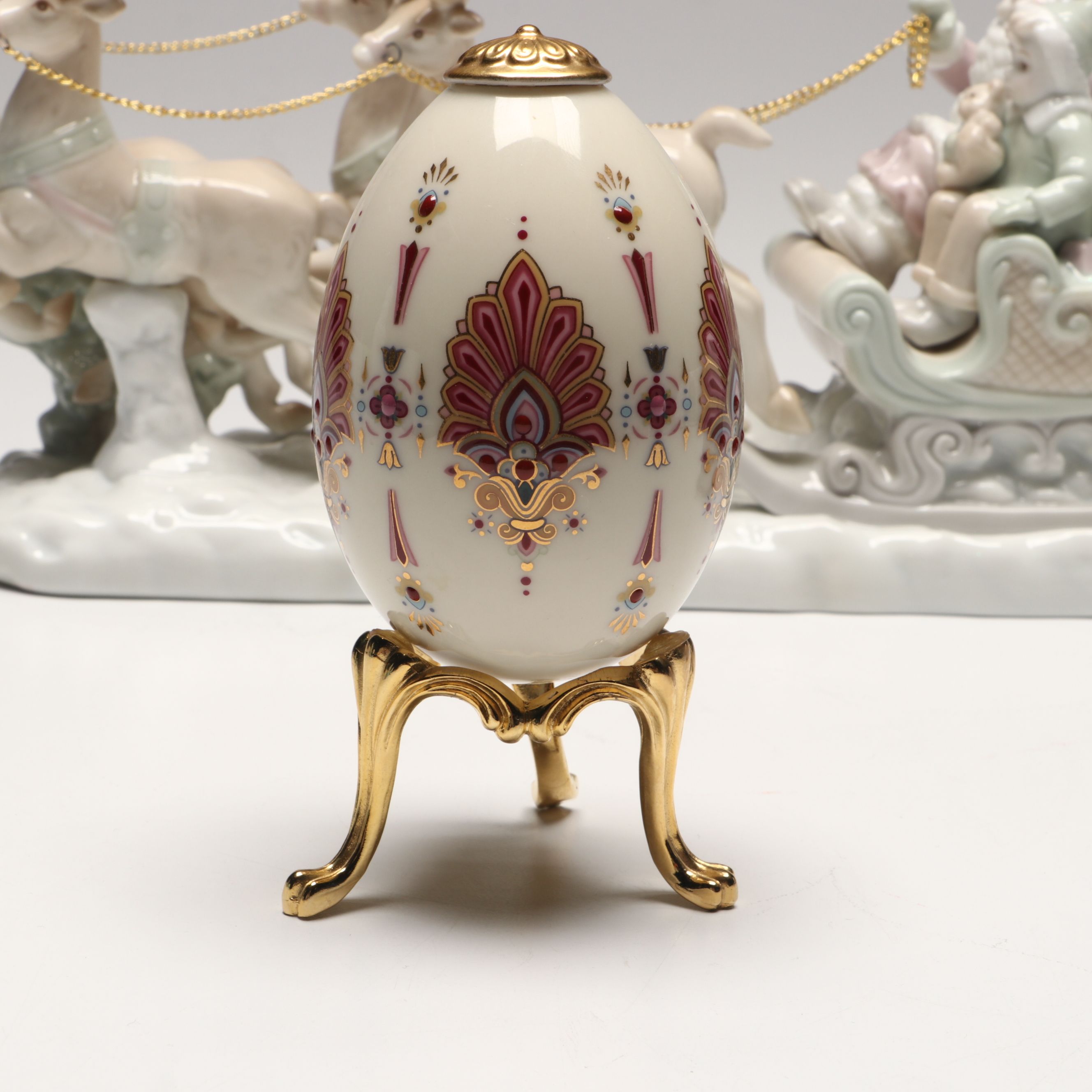 Lenox "Ruby" and Lladró Porcelain Eggs with Russ Santa's Sleigh Figurine