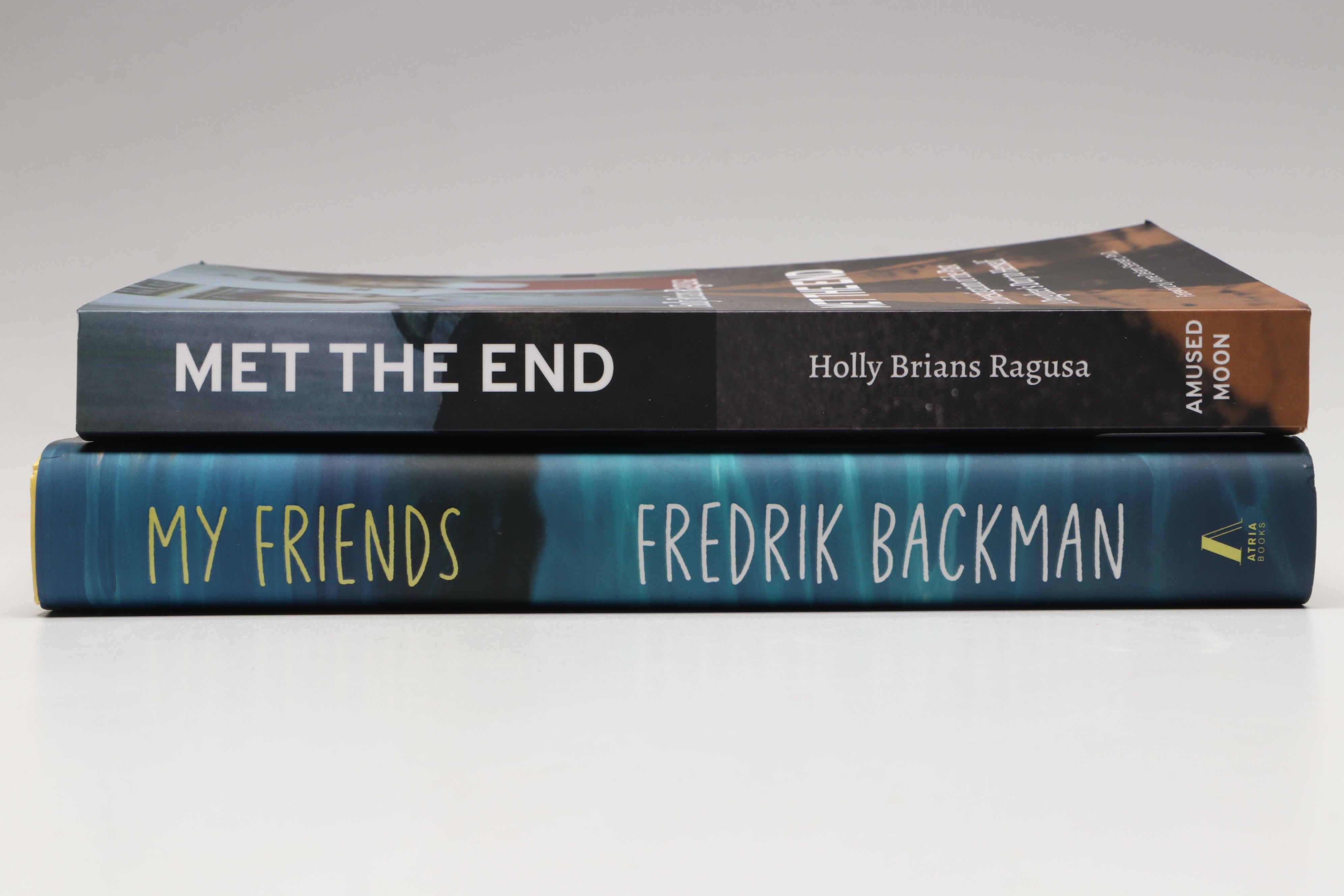 Signed "My Friends" by Fredrik Backman and "Met the End" by Holly Brians Ragusa
