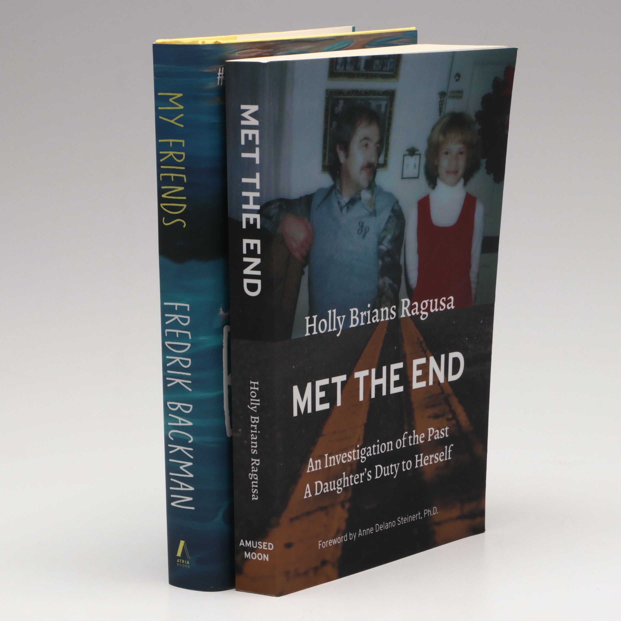 Signed "My Friends" by Fredrik Backman and "Met the End" by Holly Brians Ragusa