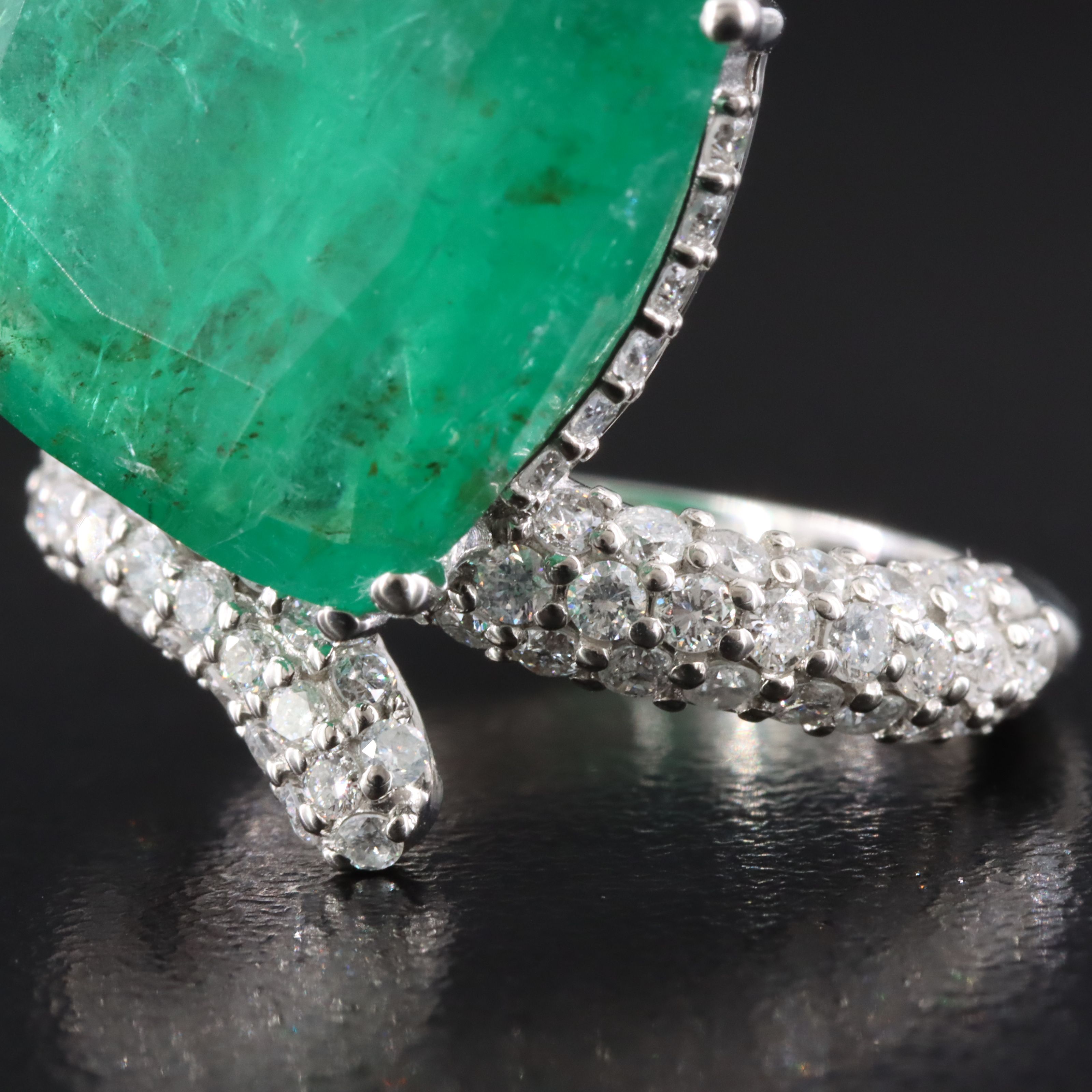 Platinum 15.51 CT Emerald and 1.28 CTW Diamond Ring