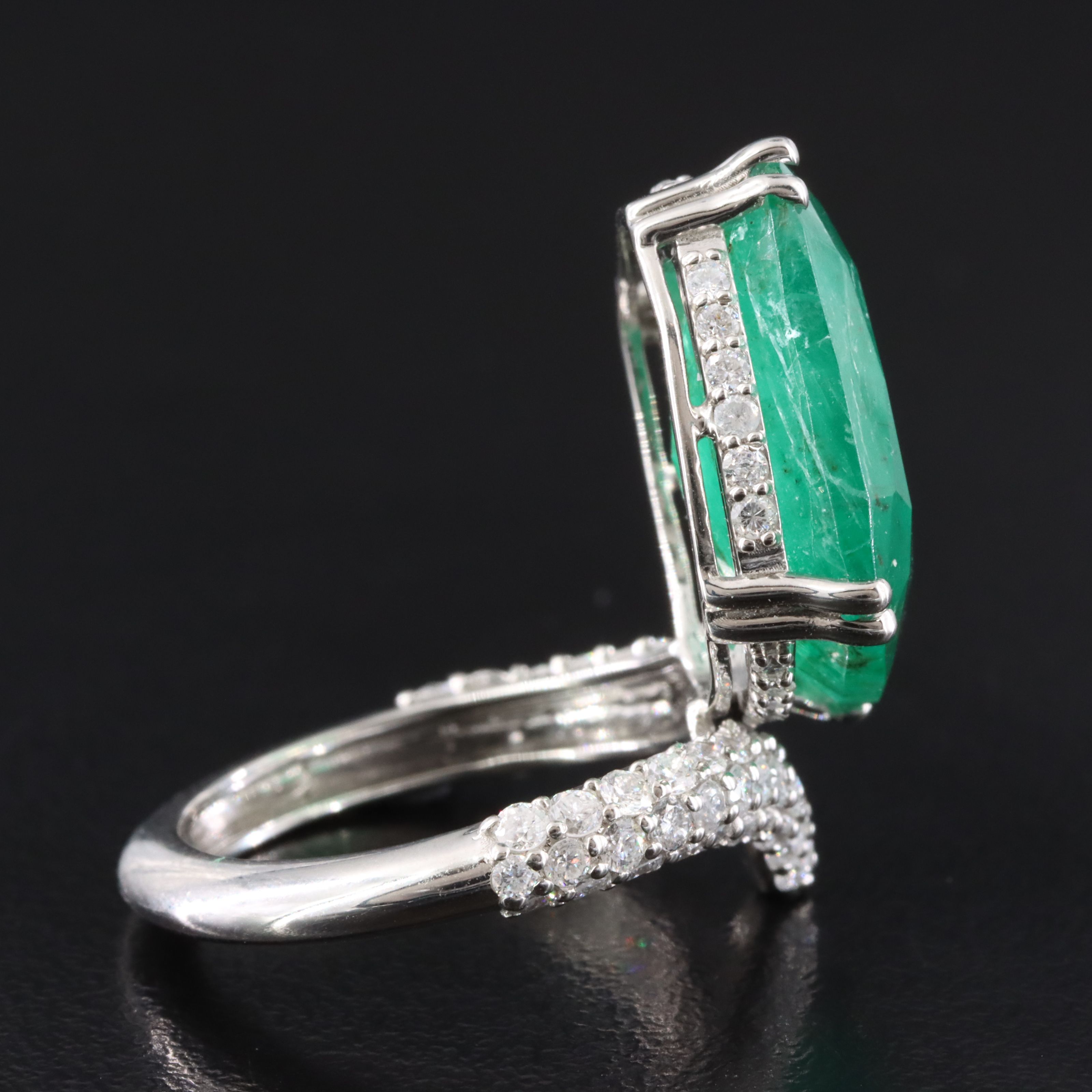 Platinum 15.51 CT Emerald and 1.28 CTW Diamond Ring