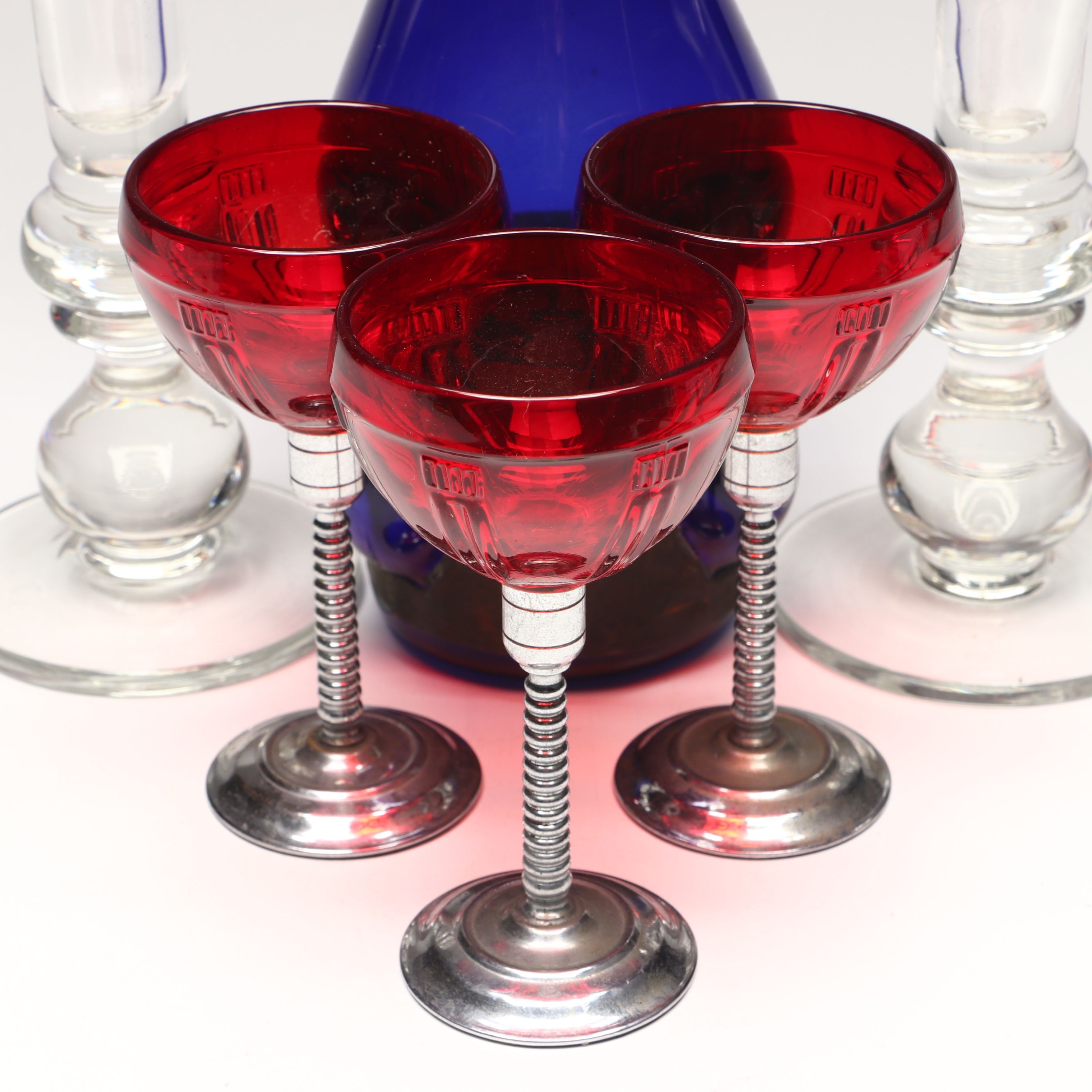 Crystal Candle Holders, Blue Glass Decanter, and Red Glass Stemware