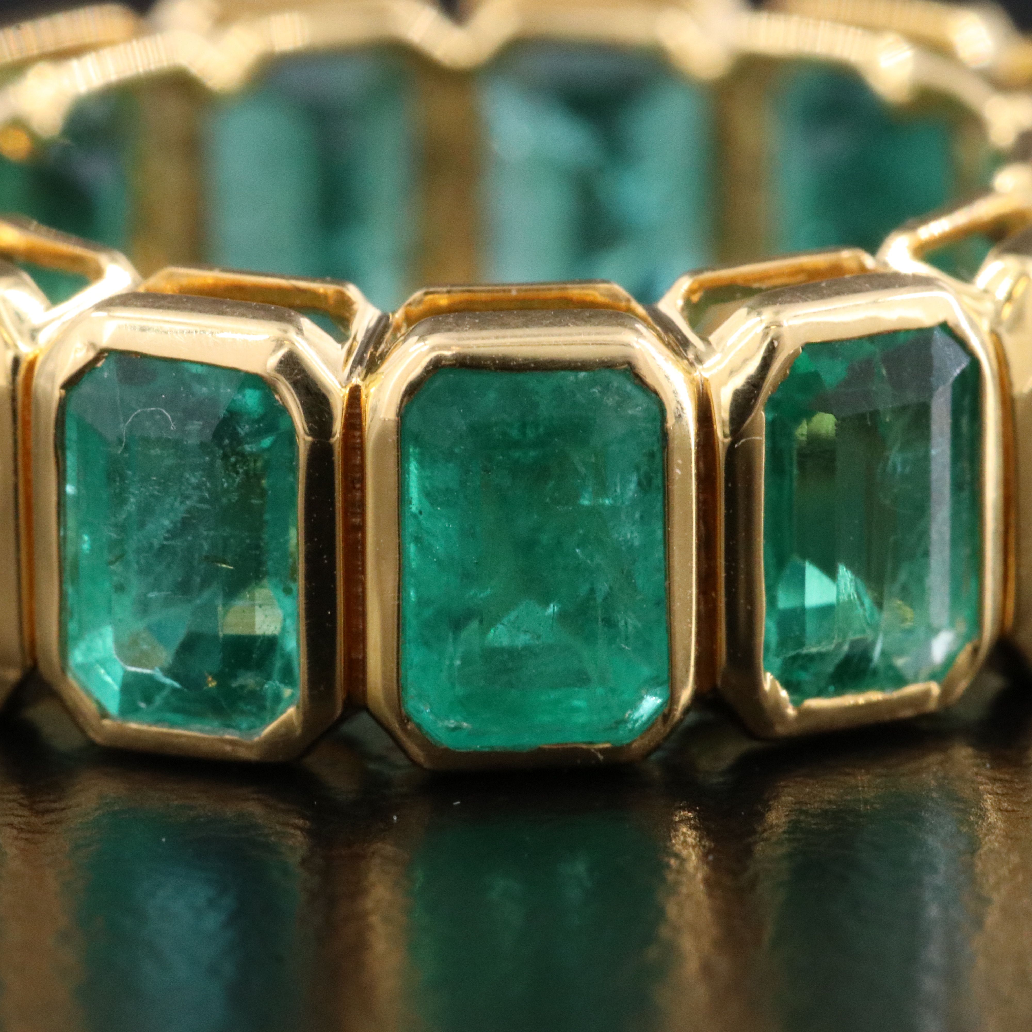 18K 8.07 CTW Emerald Eternity Band