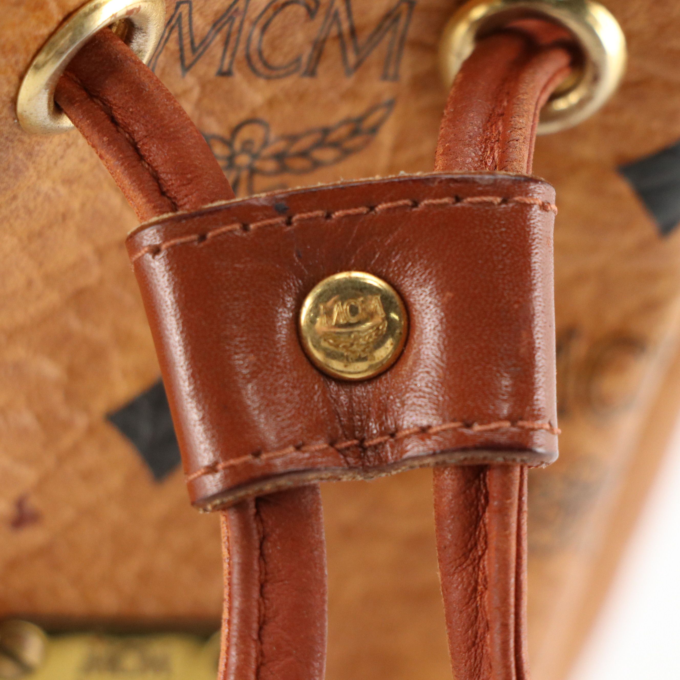 MCM Mini Drawstring Bucket Bag in Cognac Visetos Canvas with Leather Trim