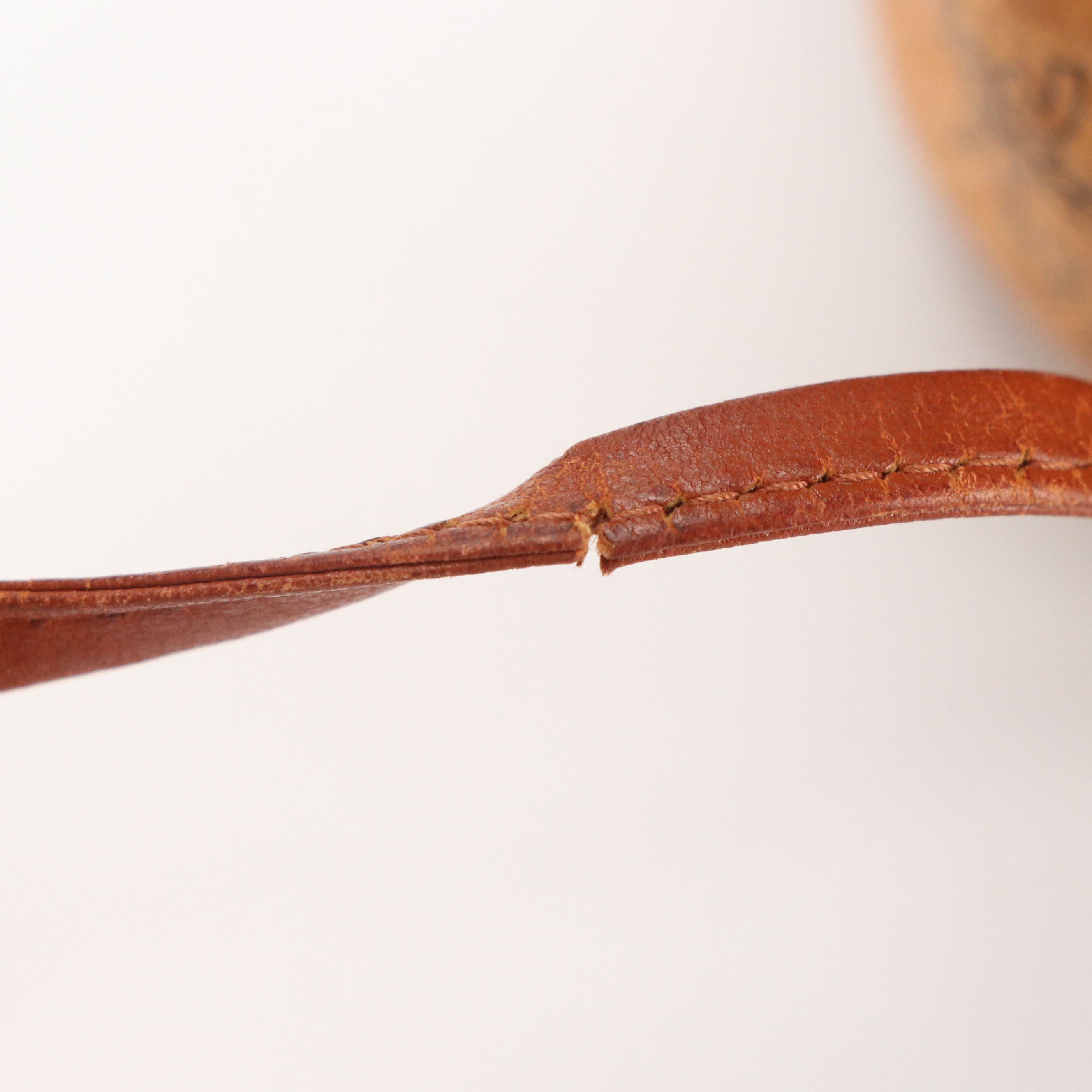 MCM Mini Drawstring Bucket Bag in Cognac Visetos Canvas with Leather Trim