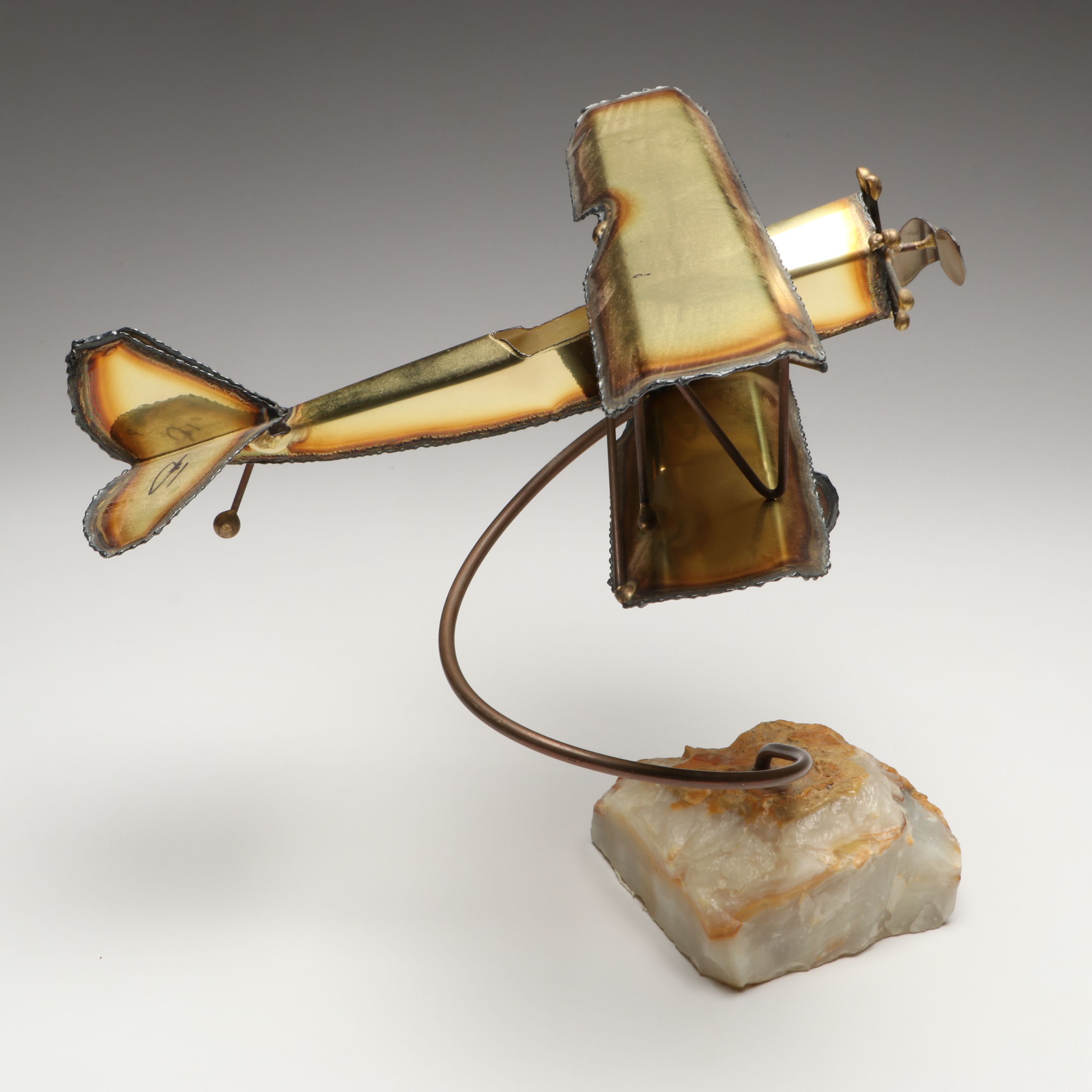 Handcrafted Metal Biplane Sculpture with Toy Cannons