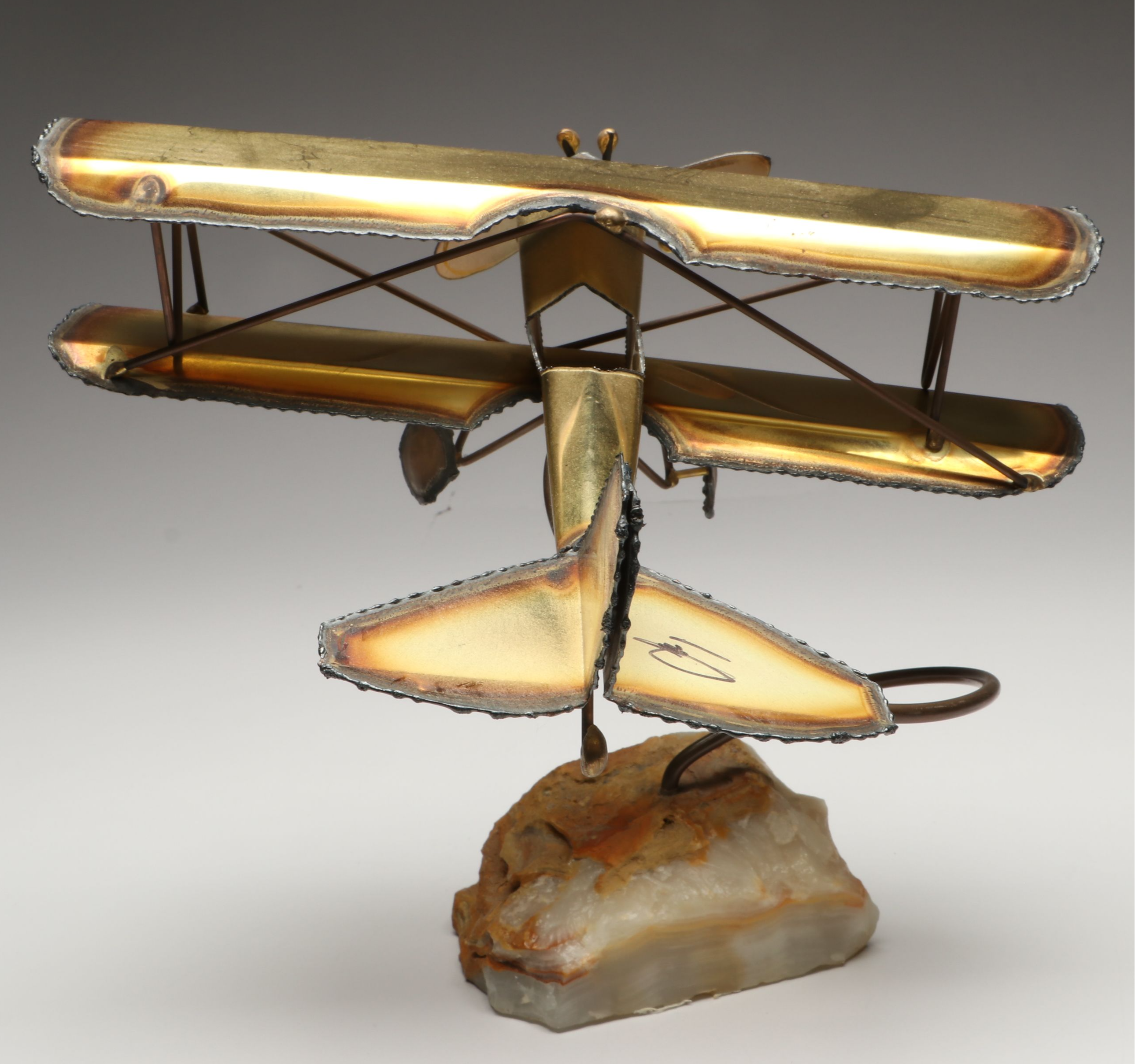 Handcrafted Metal Biplane Sculpture with Toy Cannons