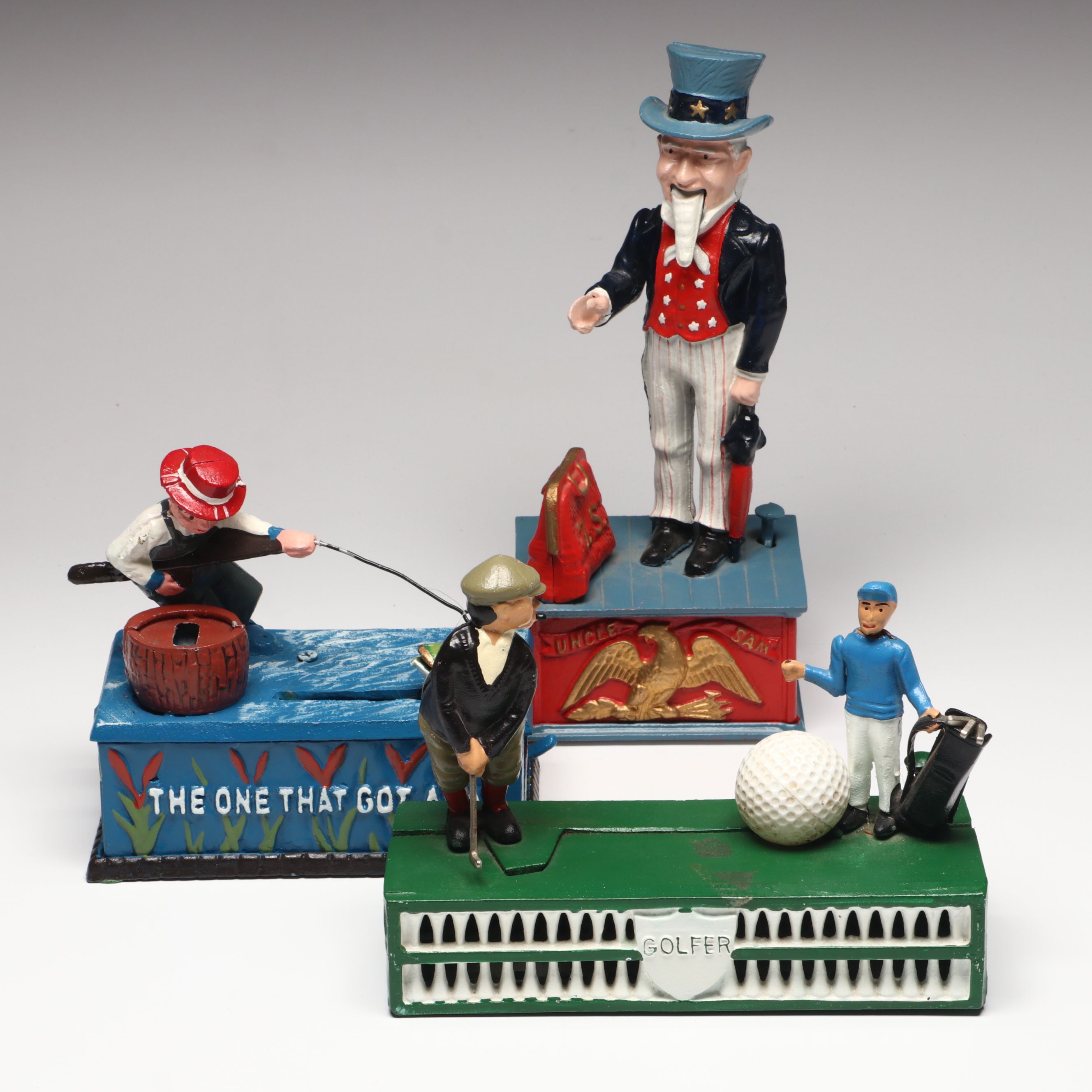 Reproduction Cold-Painted Cast Iron Uncle Sam, Golfer and Fishing Coin Banks