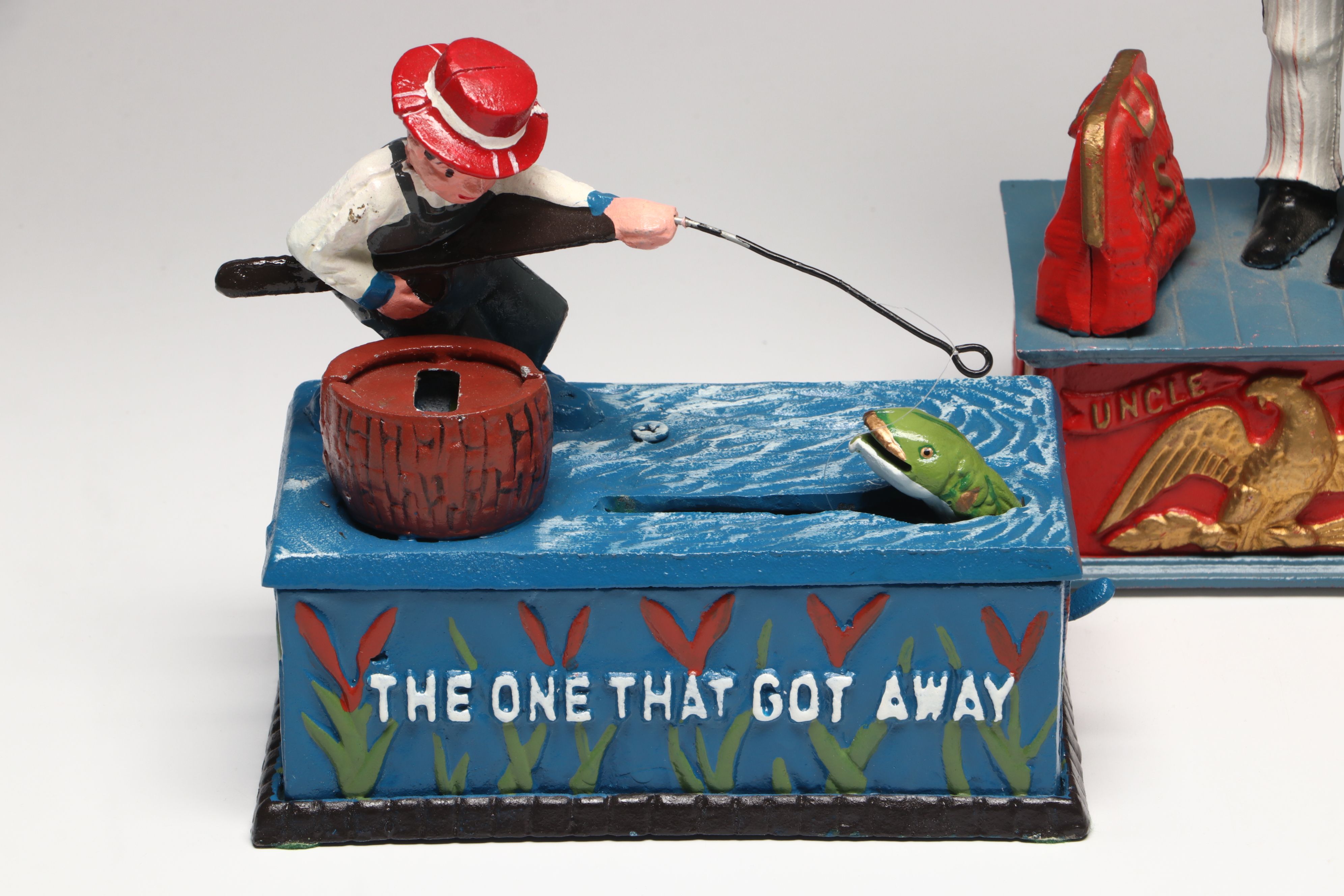 Reproduction Cold-Painted Cast Iron Uncle Sam, Golfer and Fishing Coin Banks