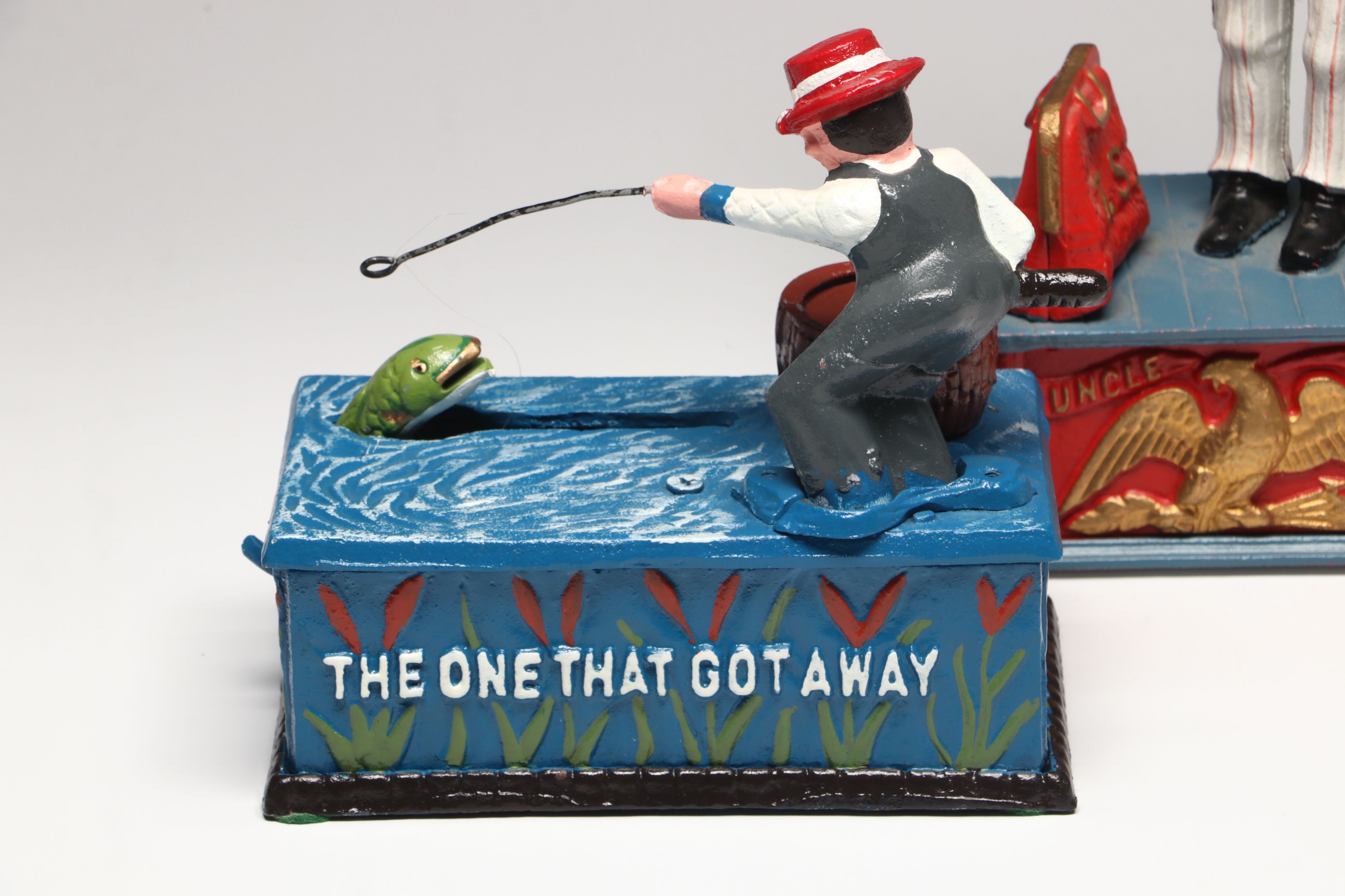 Reproduction Cold-Painted Cast Iron Uncle Sam, Golfer and Fishing Coin Banks