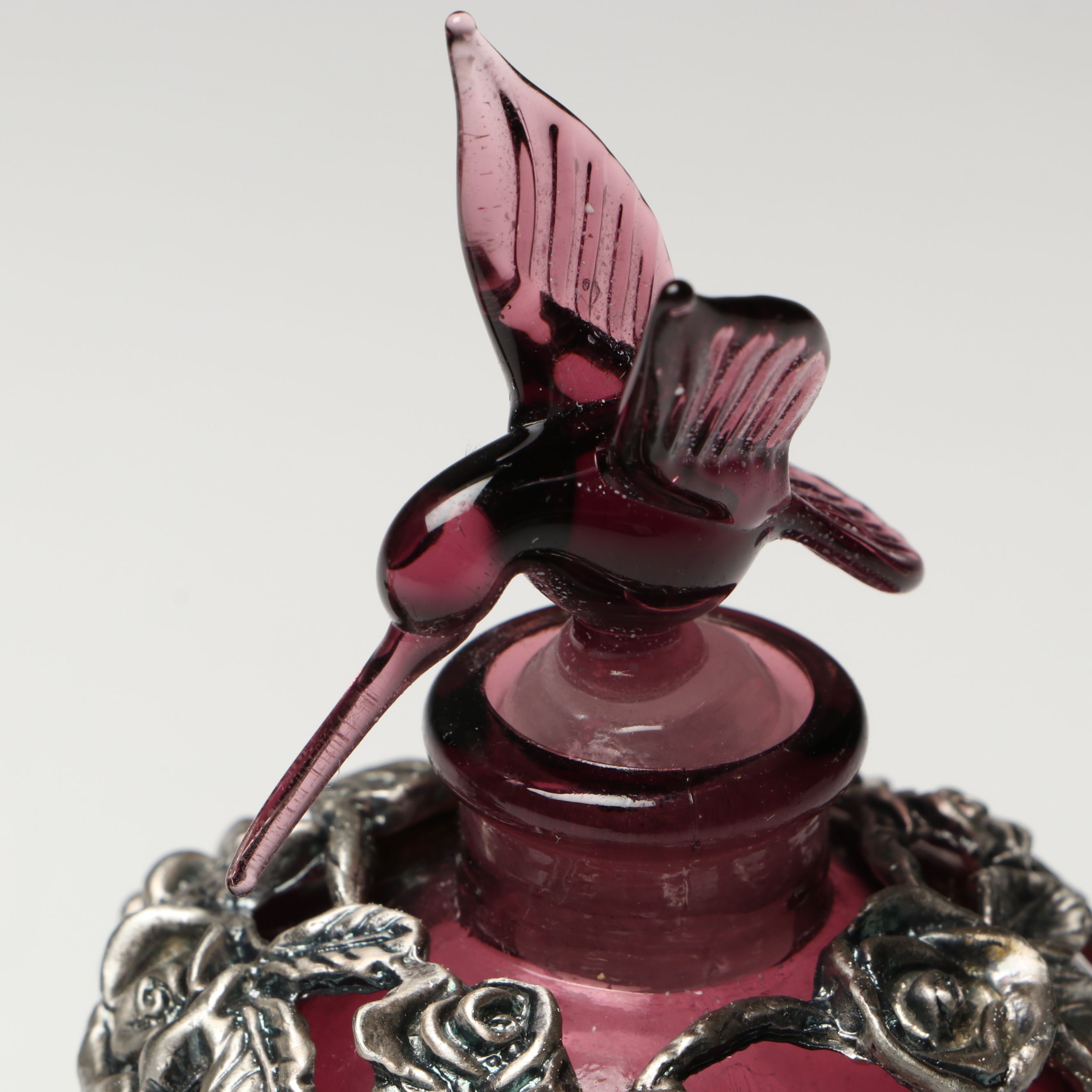 Purple and Cranberry Perfume Bottles with Floral and Hummingbird Finials