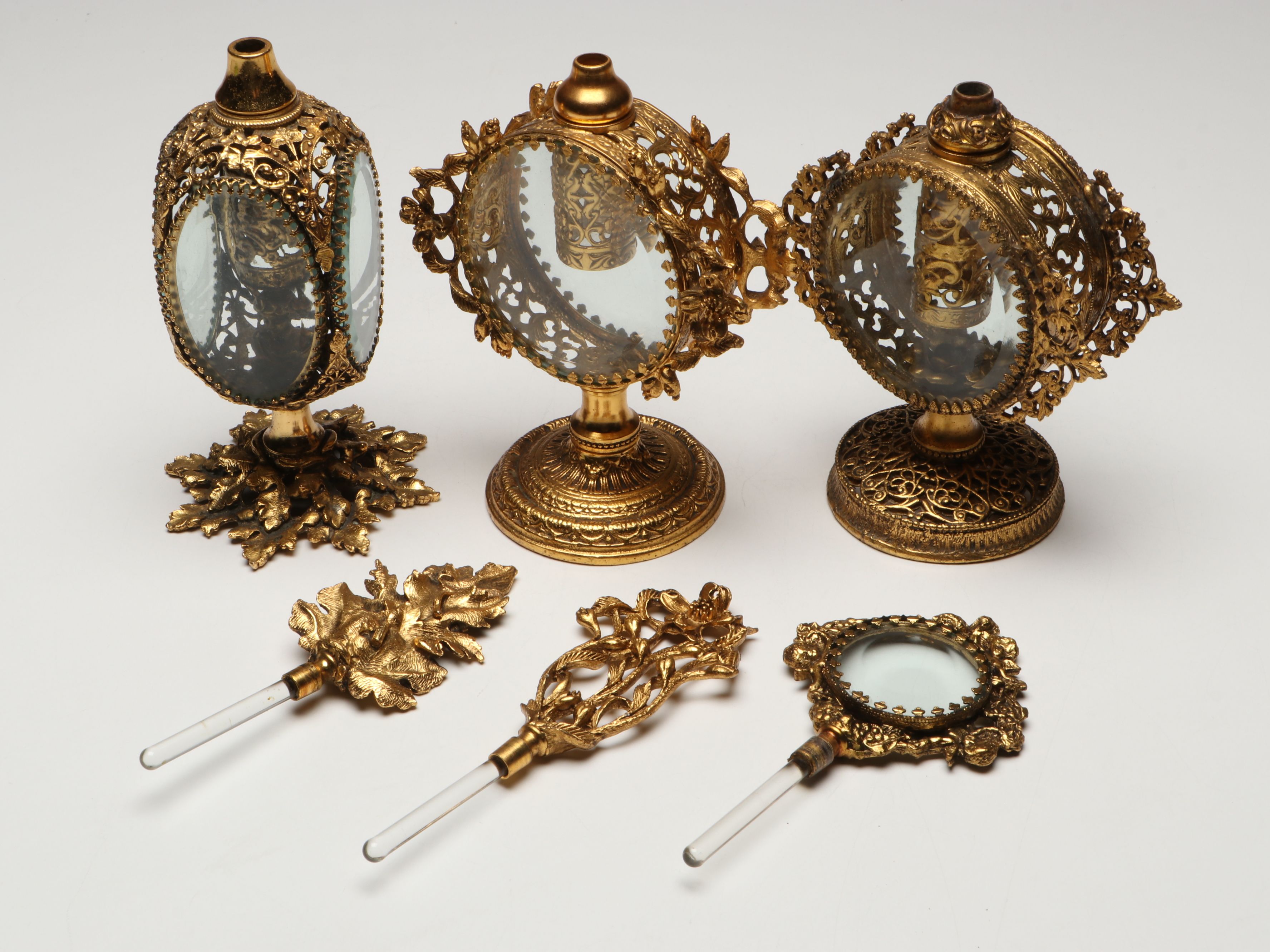 Gilt Metal Filigree and Beveled Glass Perfume Bottles with Jewelry Casket