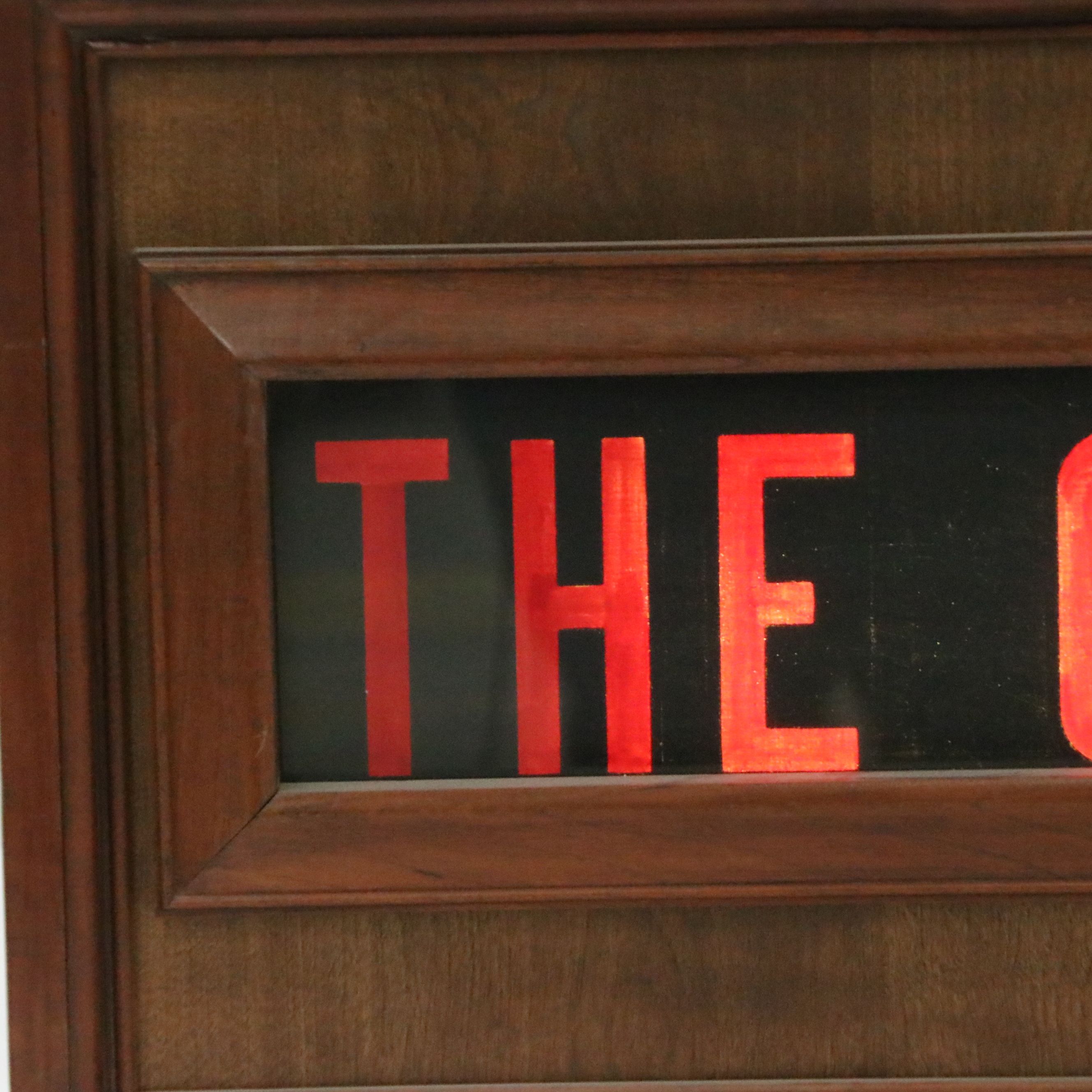 Illuminated "The Courier" Newspaper Advertising Sign