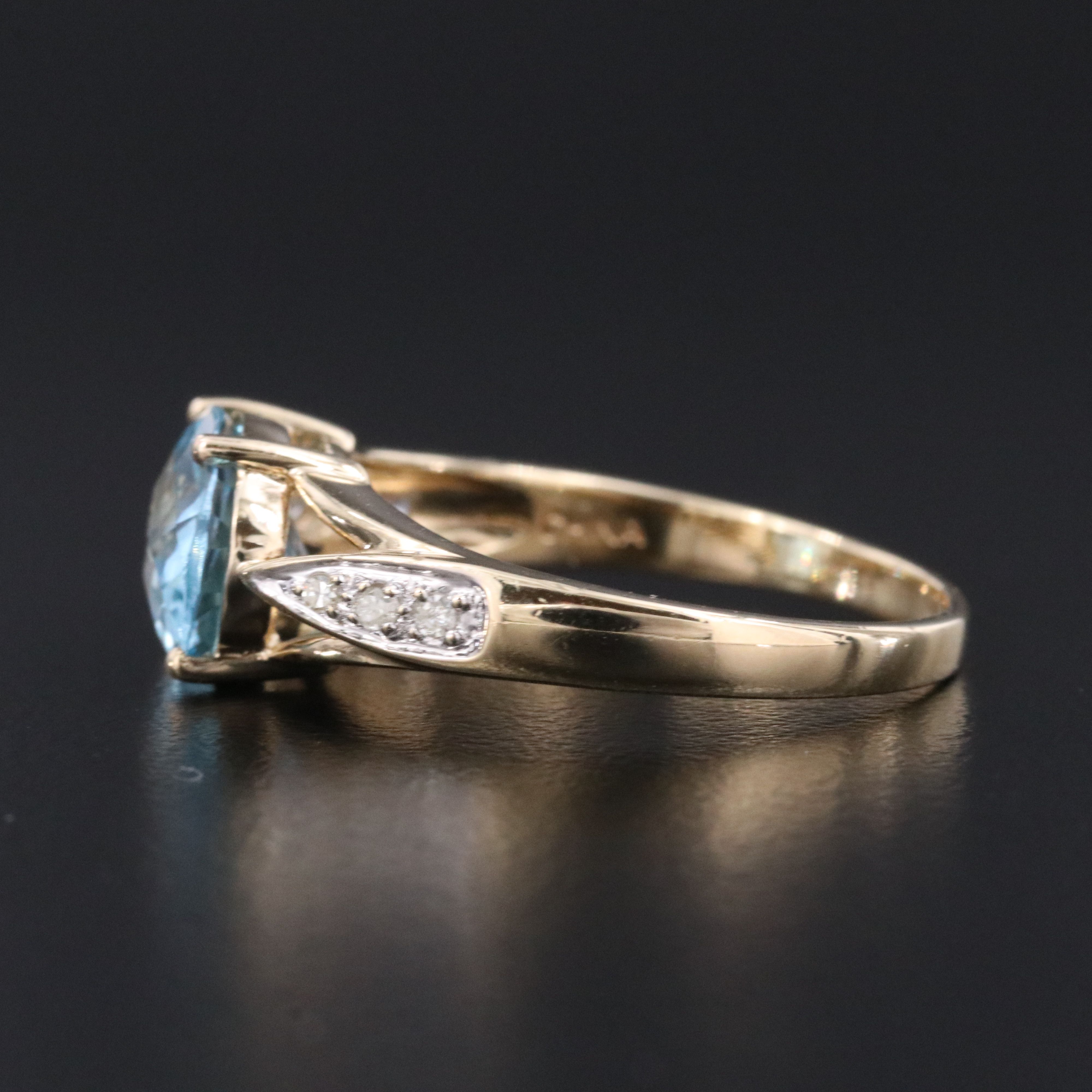 10K Swiss Blue Topaz and Diamond East West Ring