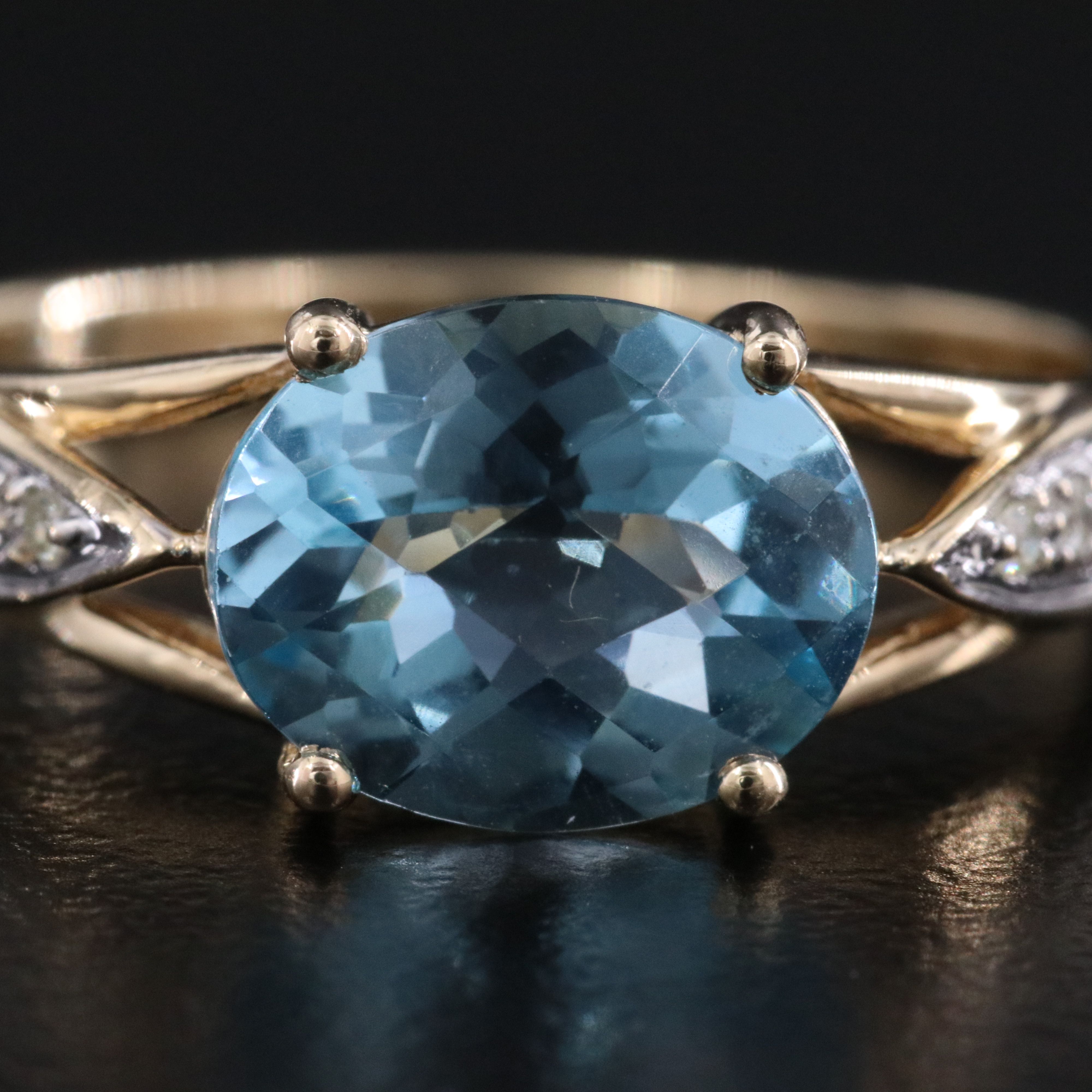 10K Swiss Blue Topaz and Diamond East West Ring