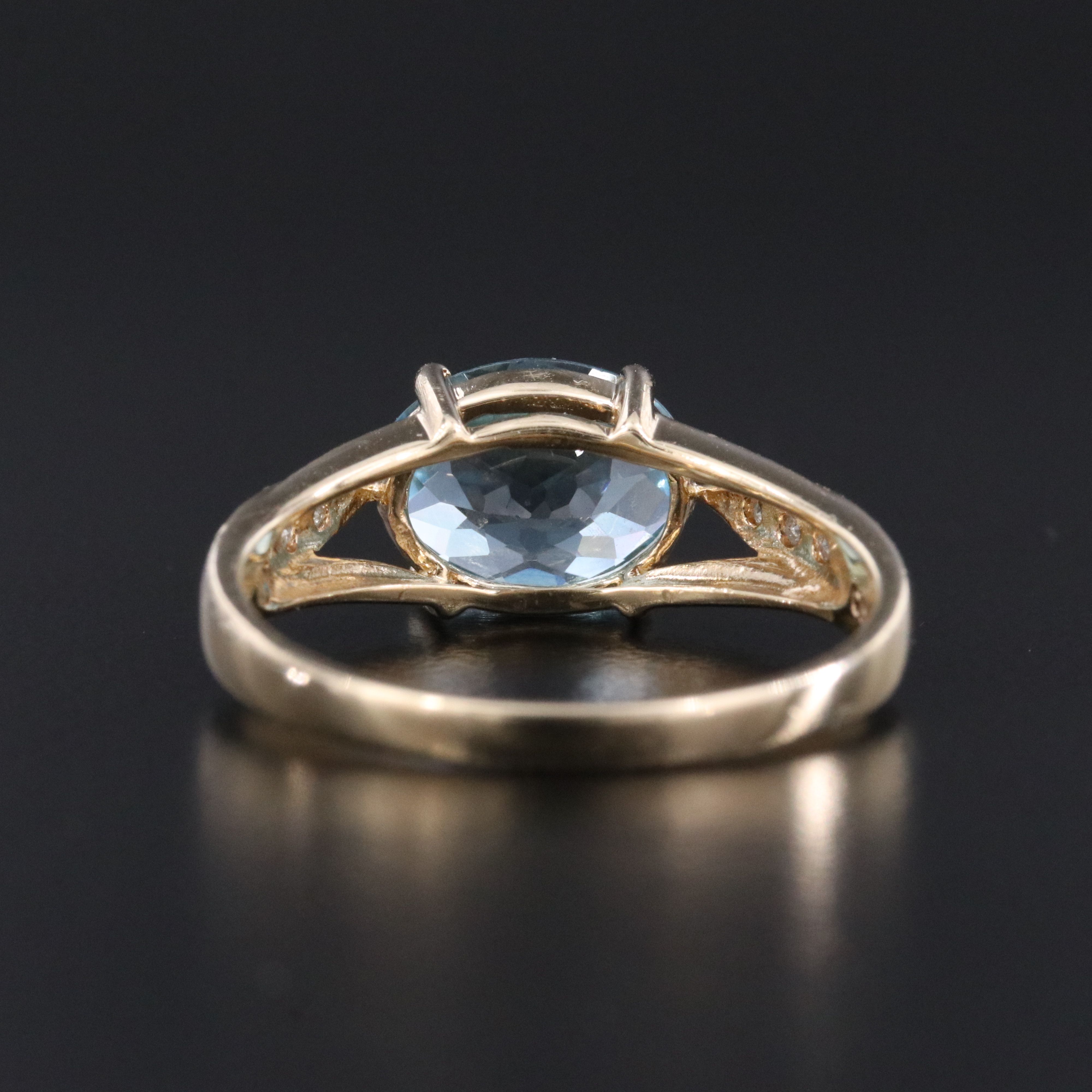 10K Swiss Blue Topaz and Diamond East West Ring